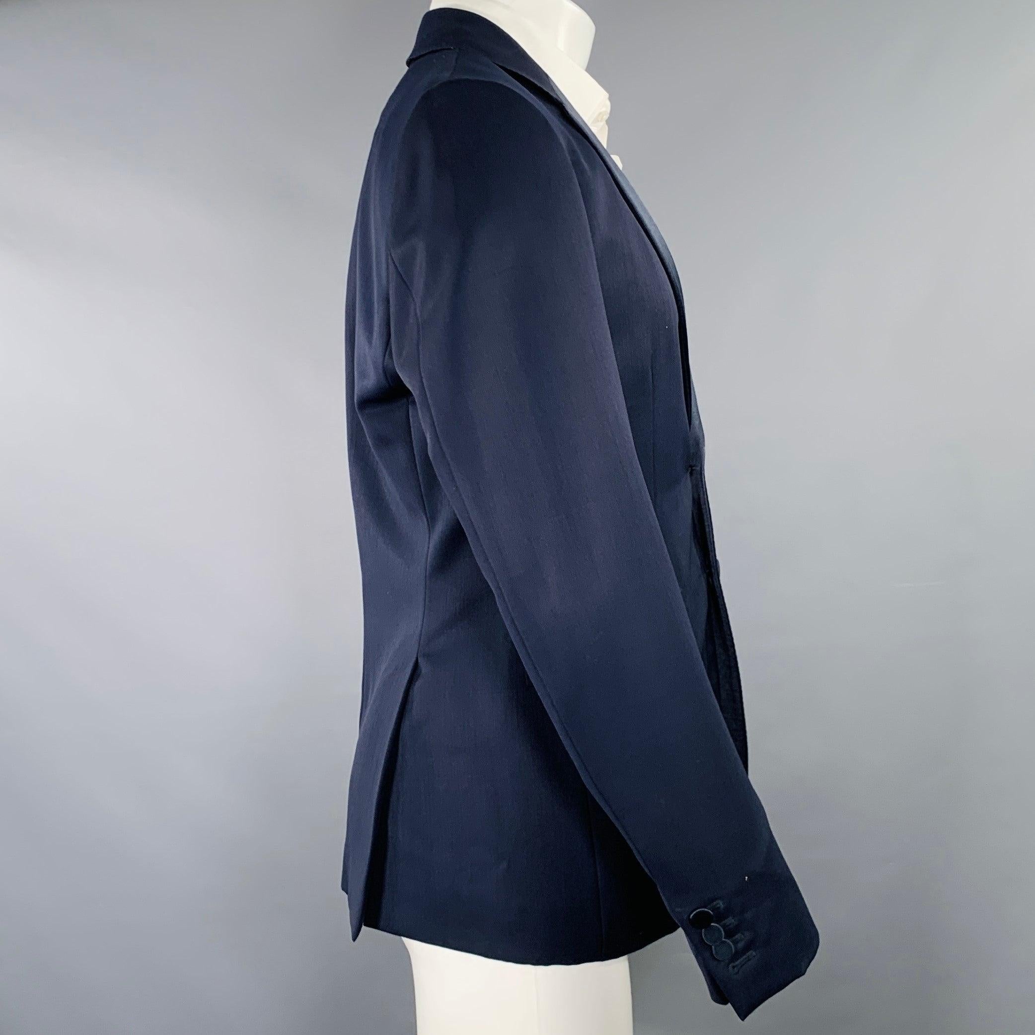 BURBERRY PRORSUM by Christopher Bailey tuxedo sport coat
in a navy virgin wool featuring a subtle peak lapel, double vented back, and double button closure. Made in Italy.Excellent Pre-Owned Condition. 

Marked:   IT 50 

Measurements: 
 
Shoulder: