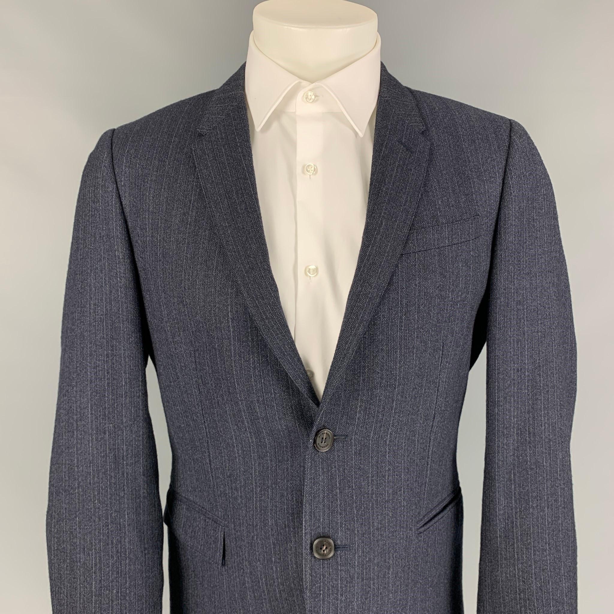 BURBERRY PRORSUM sport coat comes in a navy & grey wool with a full liner featuring a notch lapel, slit pockets, double back vent, and a double button closure. Made in Italy. 

Very Good Pre-Owned Condition.
Marked: 50

Measurements:

Shoulder: 17