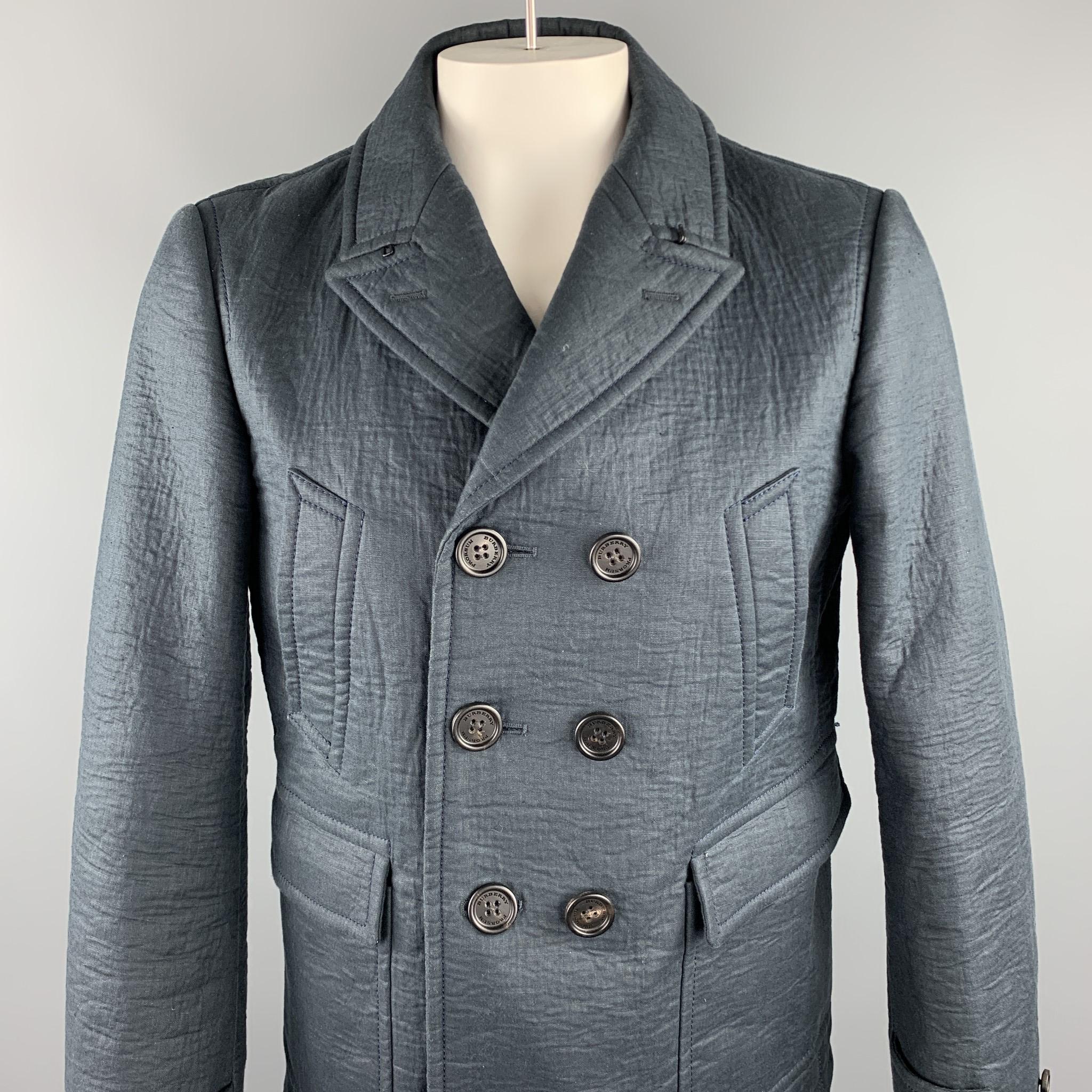 BURBERRY PRORSUM pea coat comes in a navy textured linen / wool with a full black monogram liner featuring a peak lapel, patch pockets, hook & eye, and a double breasted closure. Made in Italy.

Excellent Pre-Owned Condition.
Marked: IT