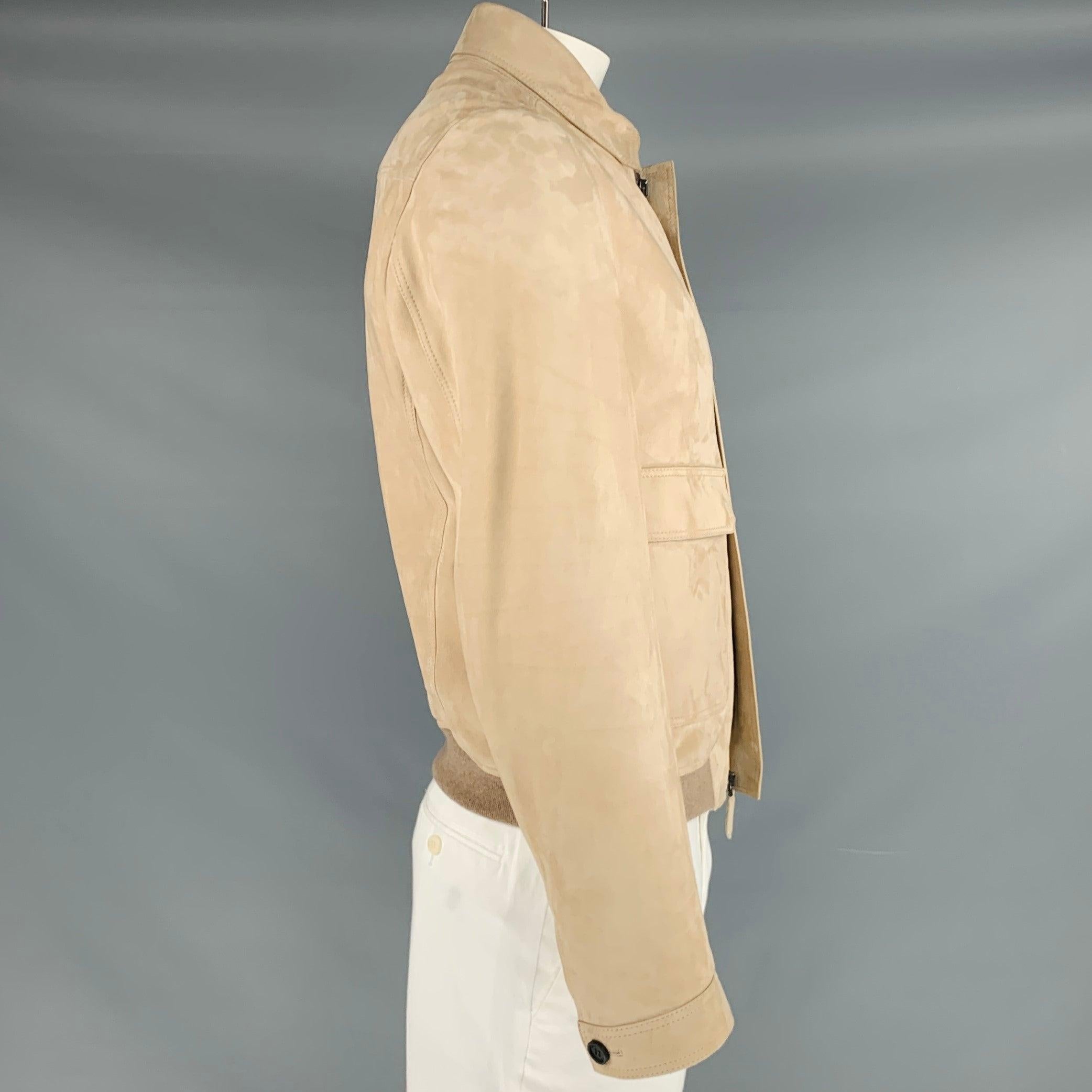 BURBERRY PRORSUM jacket in a buttery soft tan lambskin suede fabric featuring two snap pockets and hidden zip up closure. Made in Italy.Very Good Pre-Owned Condition. Minor signs of wear. 

Marked:   IT 52 

Measurements: 
 
Shoulder: 16 inches