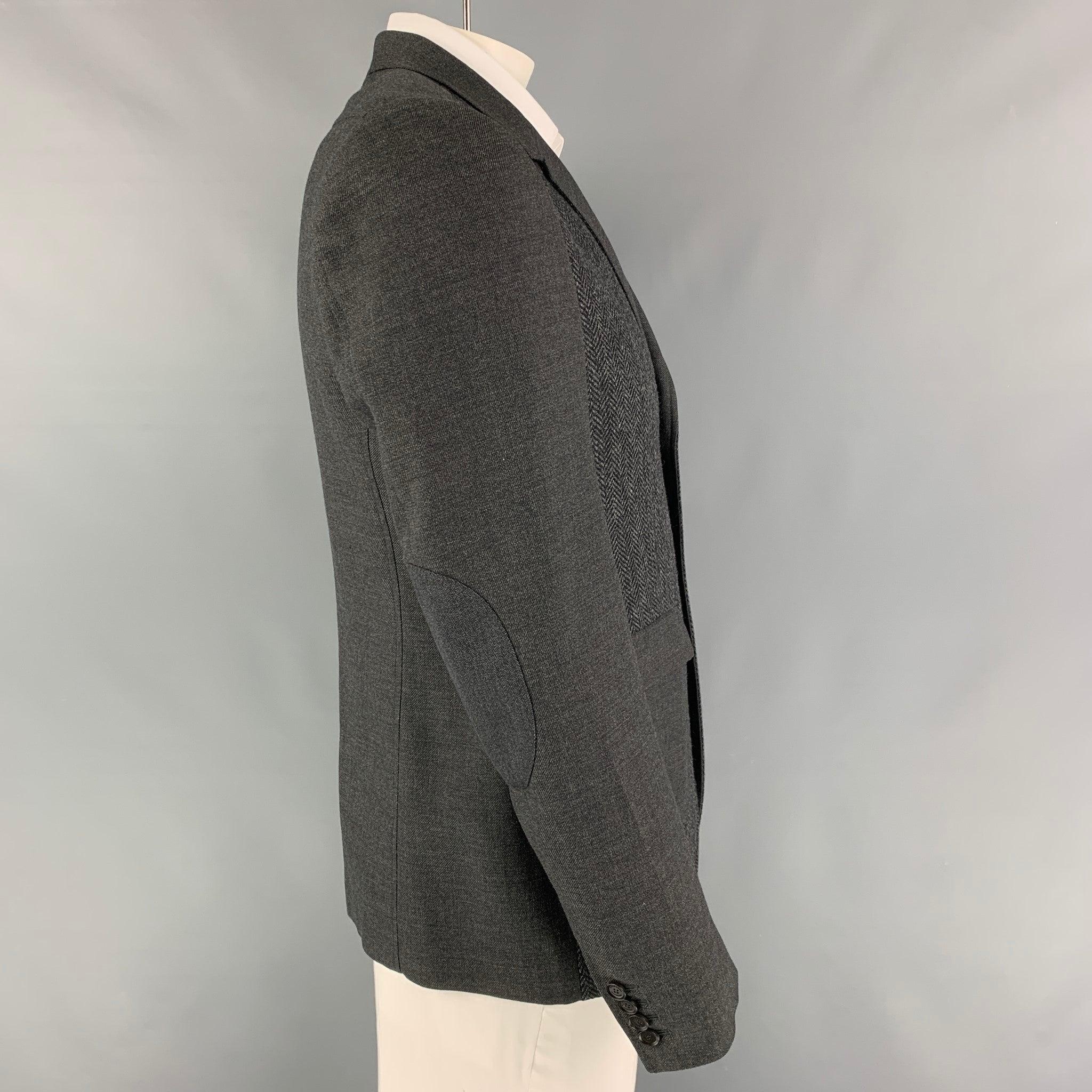 BURBERRY PRORSUM sport coat comes in a grey virgin wool with a full liner featuring a notch lapel, elbow patches, single back vent, flap pockets, and a two button closure. Made in Italy.
Excellent
Pre-Owned Condition. 

Marked:   54 

Measurements:
