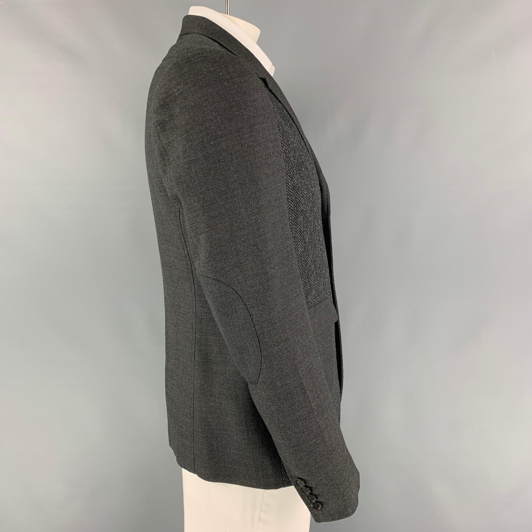 BURBERRY PRORSUM sport coat comes in a grey virgin wool with a full liner featuring a notch lapel, elbow patches, single back vent, flap pockets, and a two button closure. Made in Italy. 

Excellent Pre-Owned Condition.
Marked: