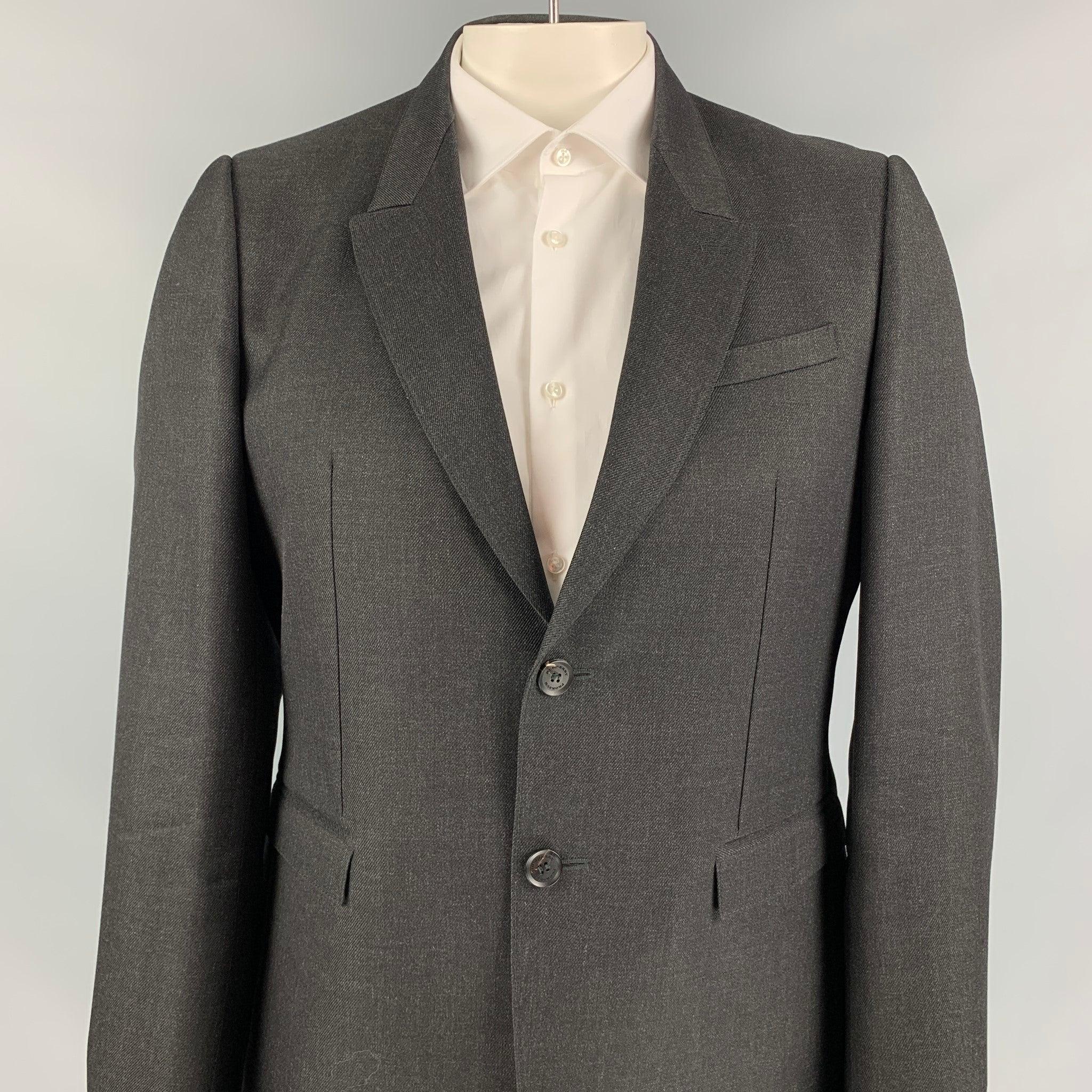 BURBERRY PRORSUM sport coat comes in a charcoal wool with a full liner featuring a peak lapel, flap pockets, double back vent, and a two button closure. Made in Italy.Excellent
Pre-Owned Condition.  

Marked:   54 

Measurements: 
 
Shoulder: 18