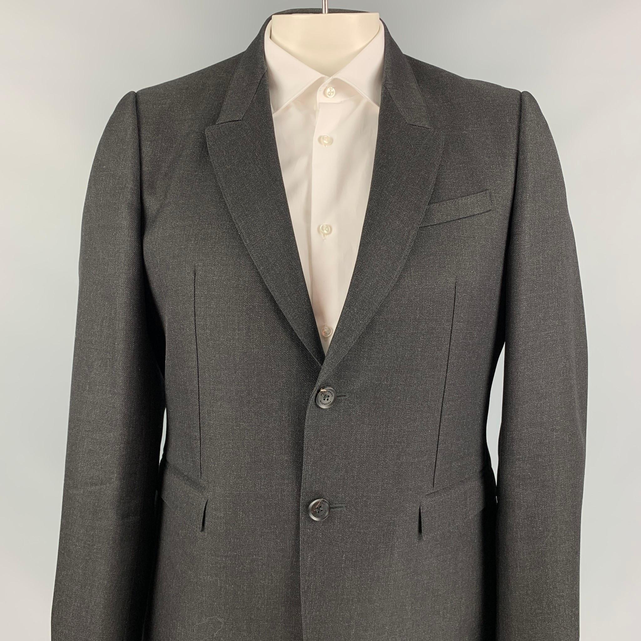 BURBERRY PRORSUM sport coat comes in a charcoal wool with a full liner featuring a peak lapel, flap pockets, double back vent, and a two button closure. Made in Italy.

Excellent Pre-Owned Condition.
Marked: 54

Measurements:

Shoulder: 18