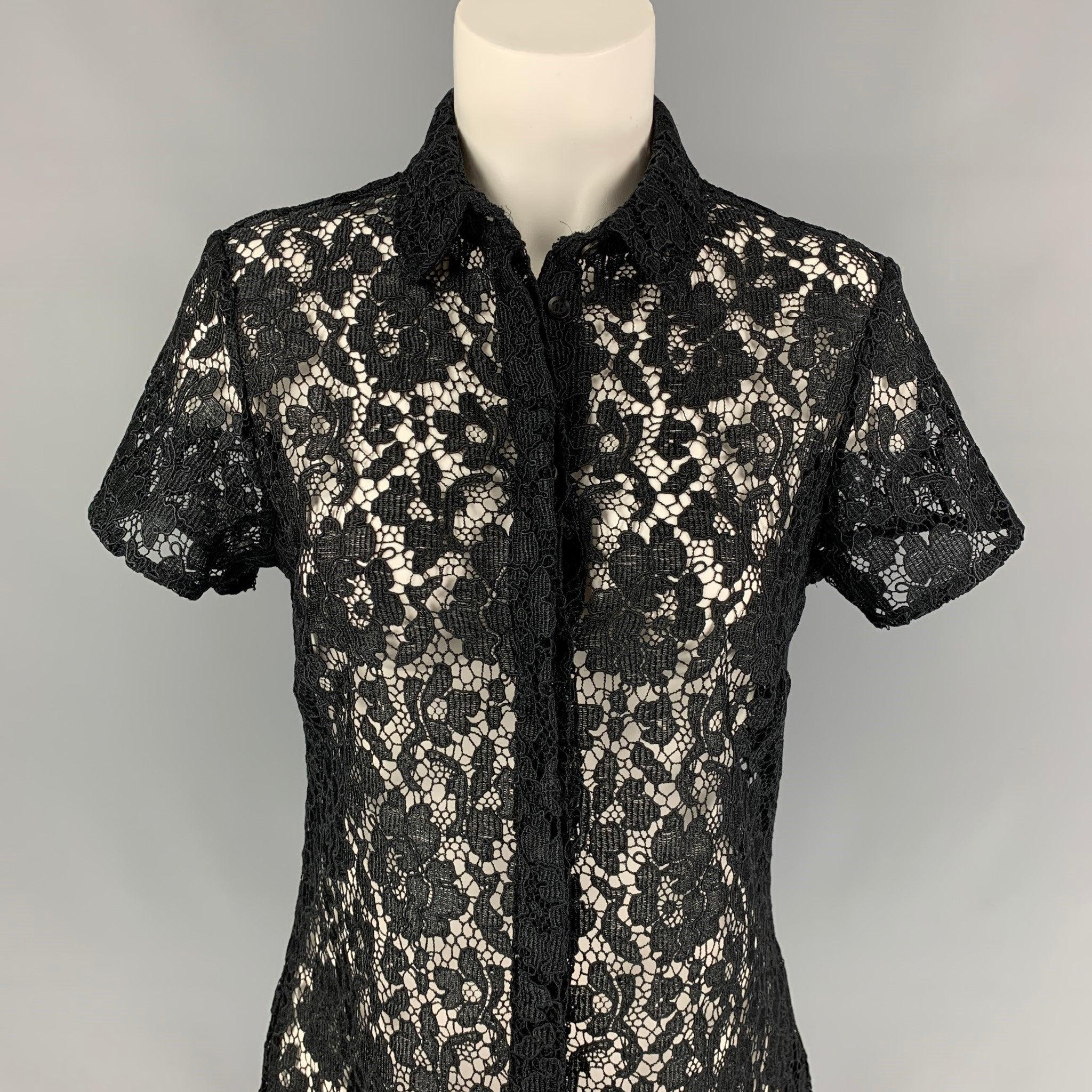 BURBERRY PRORSUM dress top comes in a black guipure see through polyester featuring a spread collar and a buttoned closure. Made in Italy.
Excellent
Pre-Owned Condition. 

Marked:   42 

Measurements: 
 
Shoulder: 15.5 inches  Bust: 34 inches 