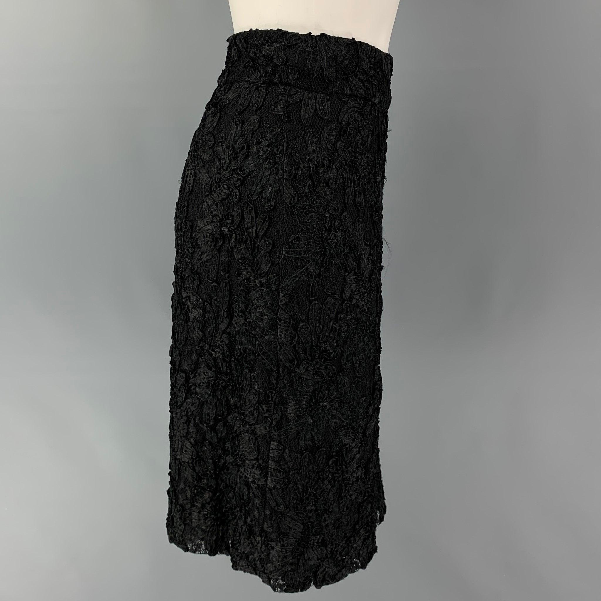 BURBERRY PRORSUM skirt comes in a black rayon / polyamide featuring a pencil style, guipure lace design, and a side zipper closure. Made in Italy.
Very Good
Pre-Owned Condition. 

Marked:   40 

Measurements: 
  Waist: 27 inches  Hip: 38 inches 