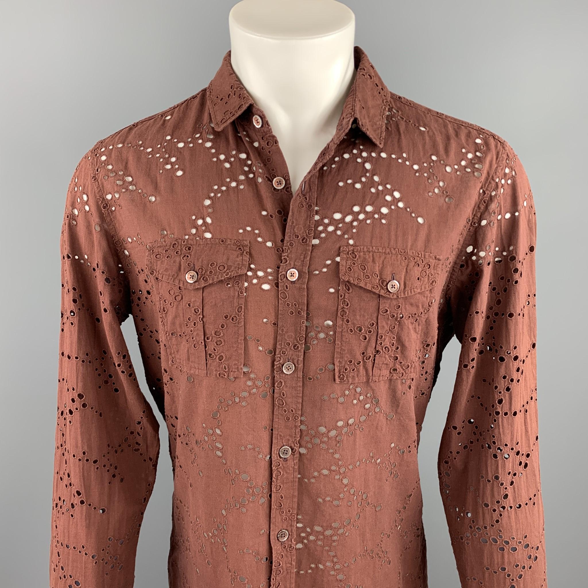 BURBERRY PRORSUM long sleeve shirt comes in a brown eyelet cotton featuring a button up style, patch pockets, and a spread collar. As-Is. Made in Italy.

Excellent Pre-Owned Condition.
Marked: 43-17

Measurements:

Shoulder: 17.5 in. 
Chest: 42 in.