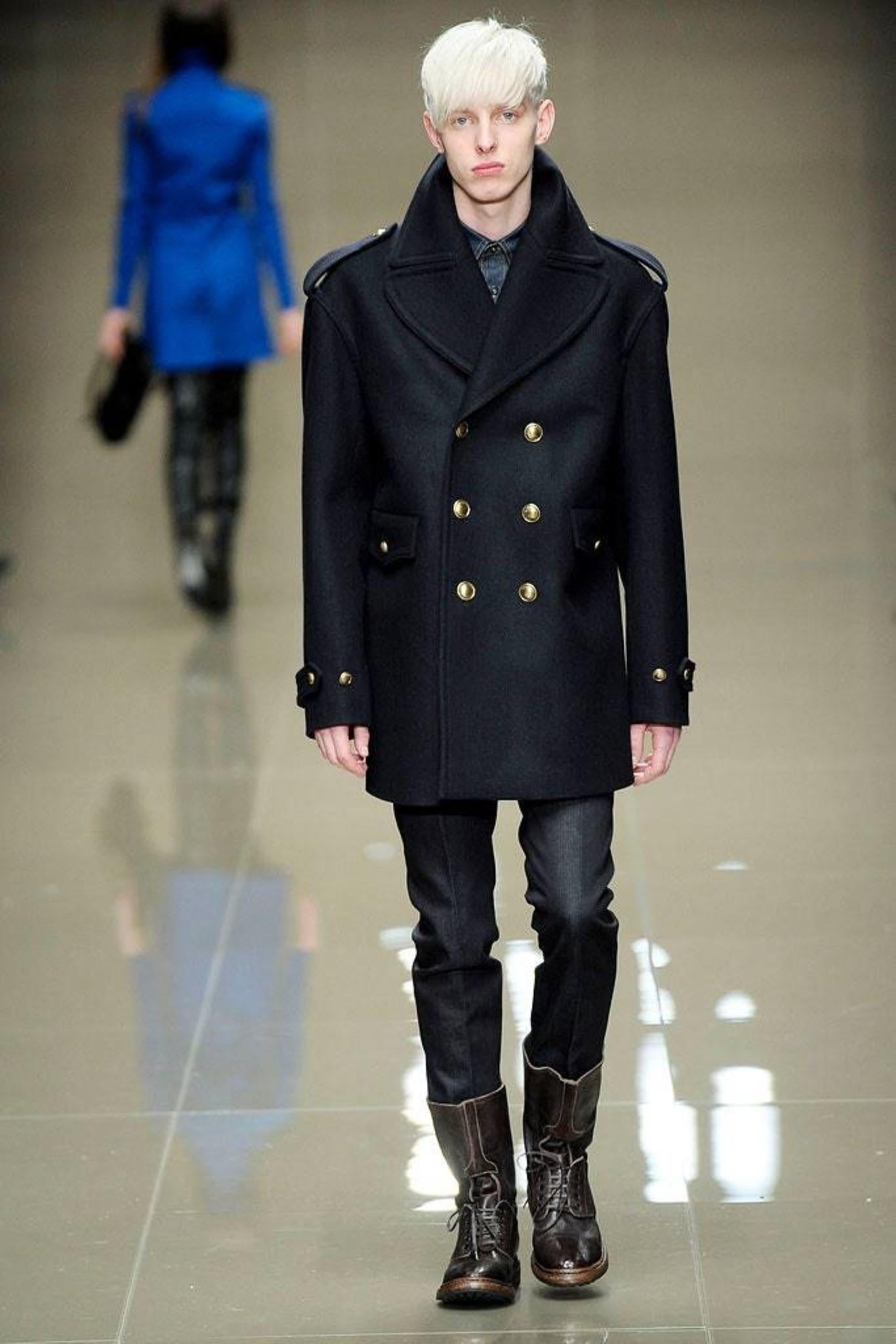 Burberry Prorsum Fall Winter 2010 Navy Oversized Double Breasted Navy Blue Peacoat by Christopher Bailey. Featuring a pointed collar, epaulets, back belt, flap pockets and button closures engraved with Burberry on each button. Signature Burberry