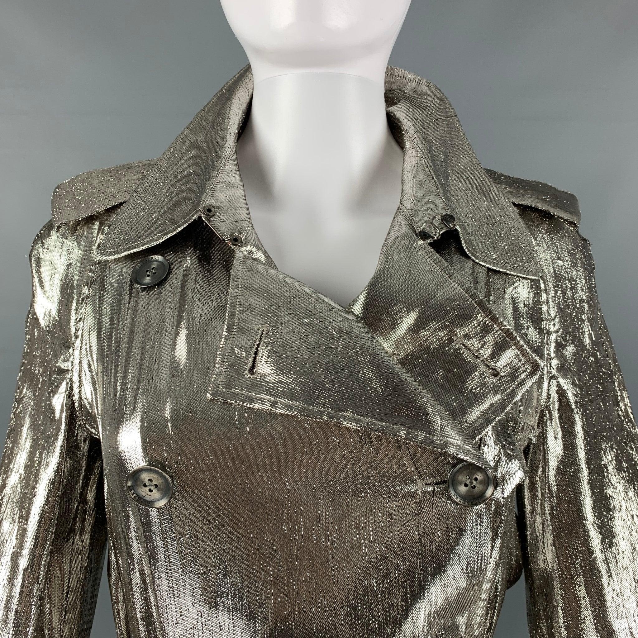 BURBERRY PRORSUM trench coat in a silver metallic woven material featuring a double breasted and belted style, notch lapel, and button closure. Made in Italy.Very Good Pre-Owned Condition. Minor signs of wear. 

Marked:   S 

Measurements: 
