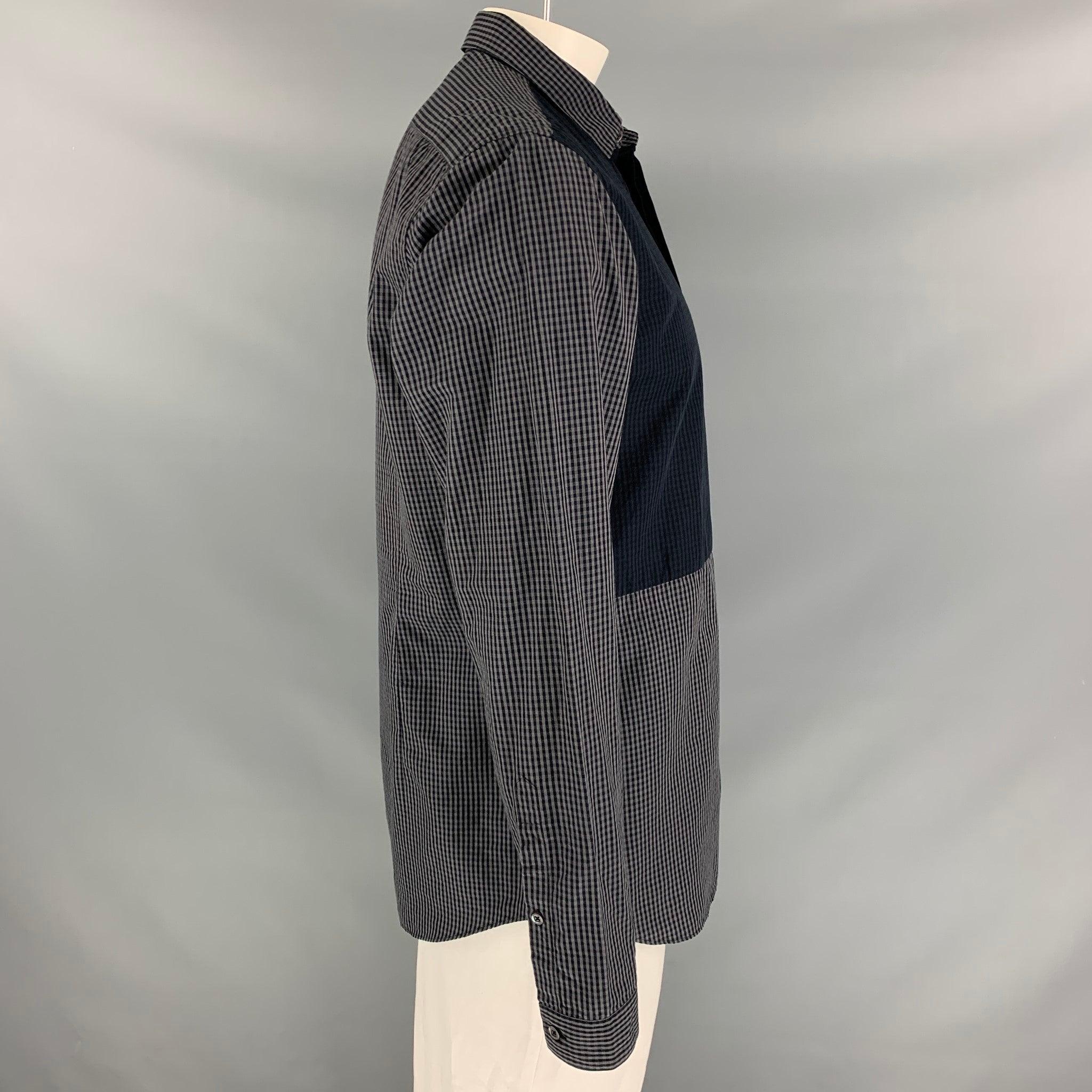 BURBERRY PRORSUM long sleeve shirt comes in a grey gingham silk / cotton featuring a spread collar and a hidden button closure. Made in Italy.Very Good
Pre-Owned Condition. 

Marked:   43/17 

Measurements: 
 
Shoulder: 19.5 inches  Chest: 44 inches
