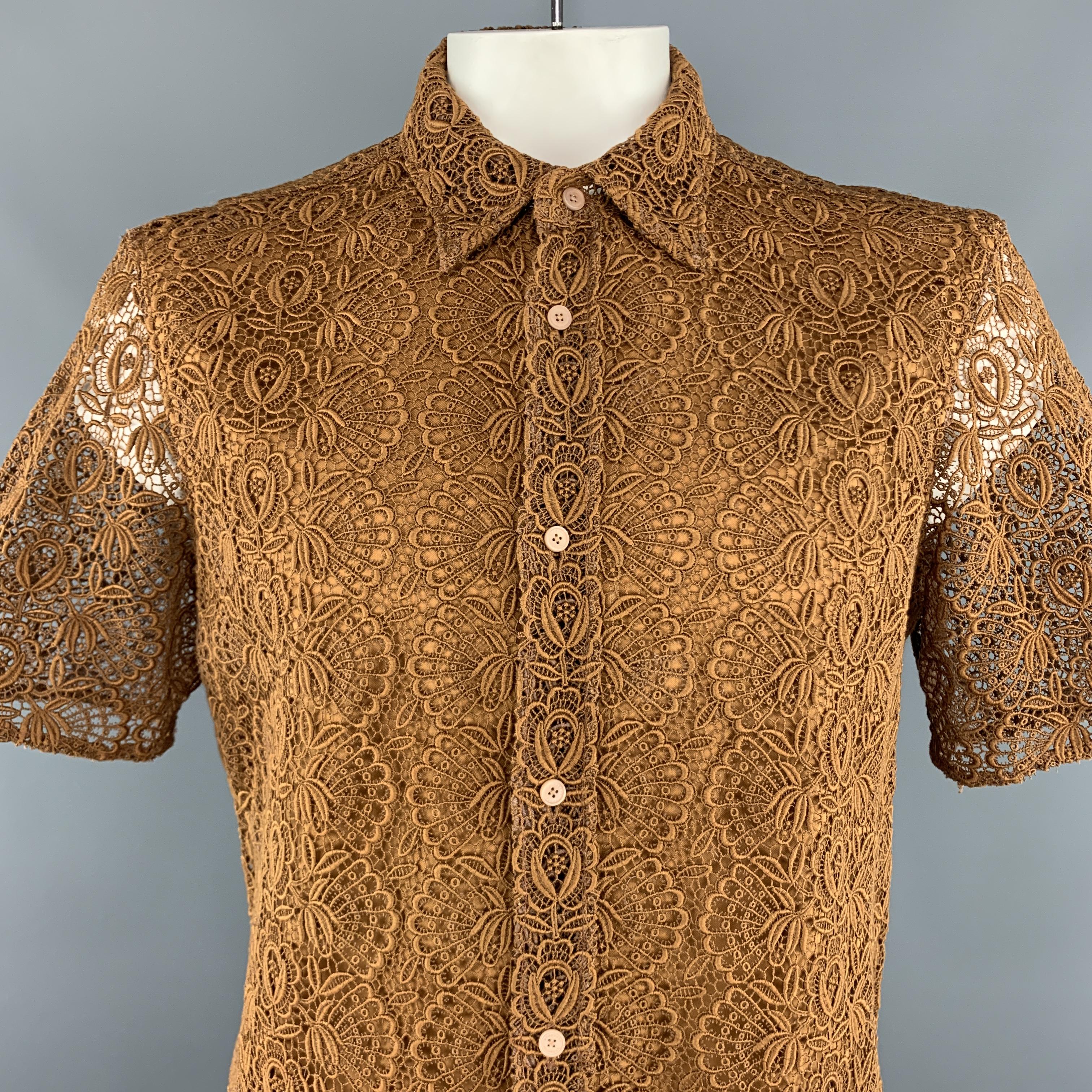 BURBERRY PRORSUM short sleeve shirt comes in a golden tan brown chunky lace with a pointed collar, and sheer, unlined back. Made in Italy.

Excellent Pre-Owned Condition.
Marked:  17 43

Measurements:

Shoulder: 19 in.
Chest: 48 in.
Sleeve: 11