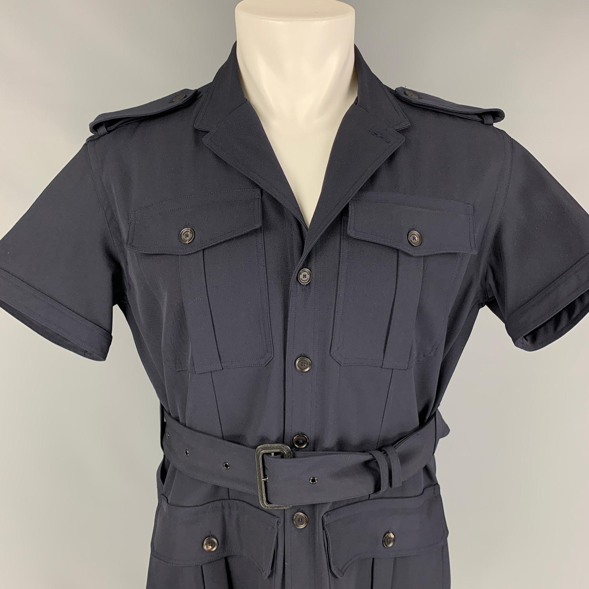 BURBERRY PRORSUM Spring 2011 jacket comes in a navy wool featuring a military style, short sleeves, belted, front pockets, and a buttoned closure. Made in Italy. 

Excellent Pre-Owned Condition.
Marked: 40

Measurements:

Shoulder: 18.5 in.
Chest: