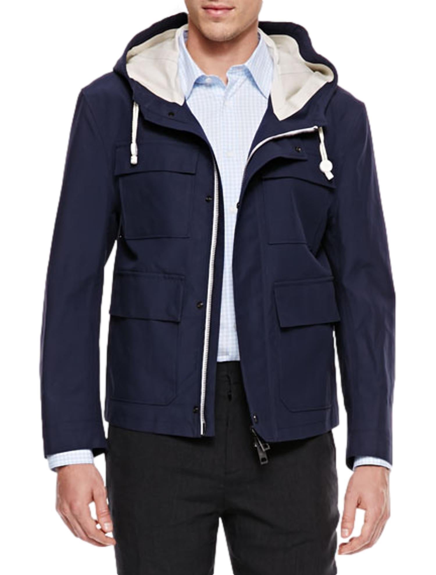 Burberry Prorsum Spring 2014 Navy Blue Sealed-Seam Hooded Cotton Jacket by Christopher Bailey. Cotton jacket is weather proof with seamed seals. Drawstring hood with contrast lining with logo details; snap/zip front. Front four flap pockets. Long