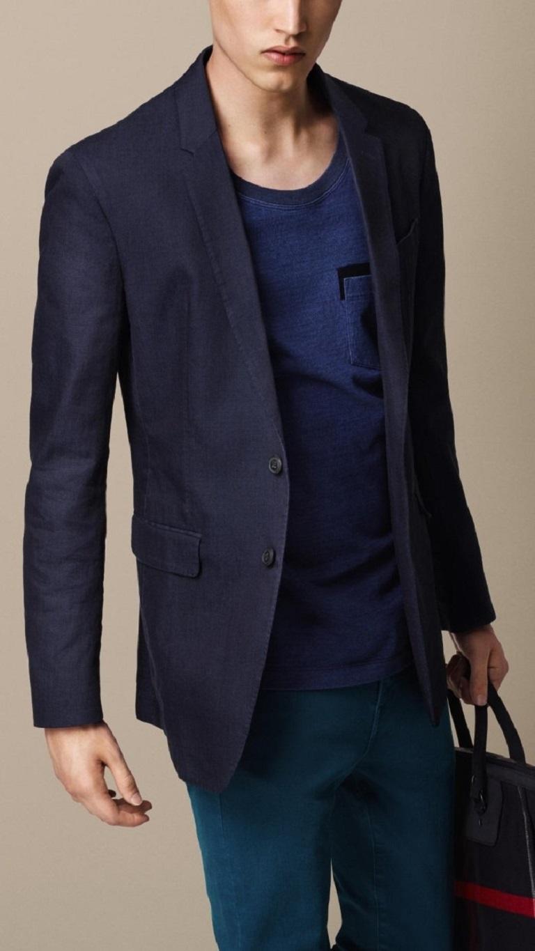 Burberry Prorsum Spring 2015 Indigo Blue Raw Edge Denim Blazer Jacket by Christopher Bailey, Notched Lapels & Double Vents, Three Pockets & Woven Lining, Two-Button Closure at Front. Country of Origin: ItalyVery Good Pre-Owned Condition. Minor wear.