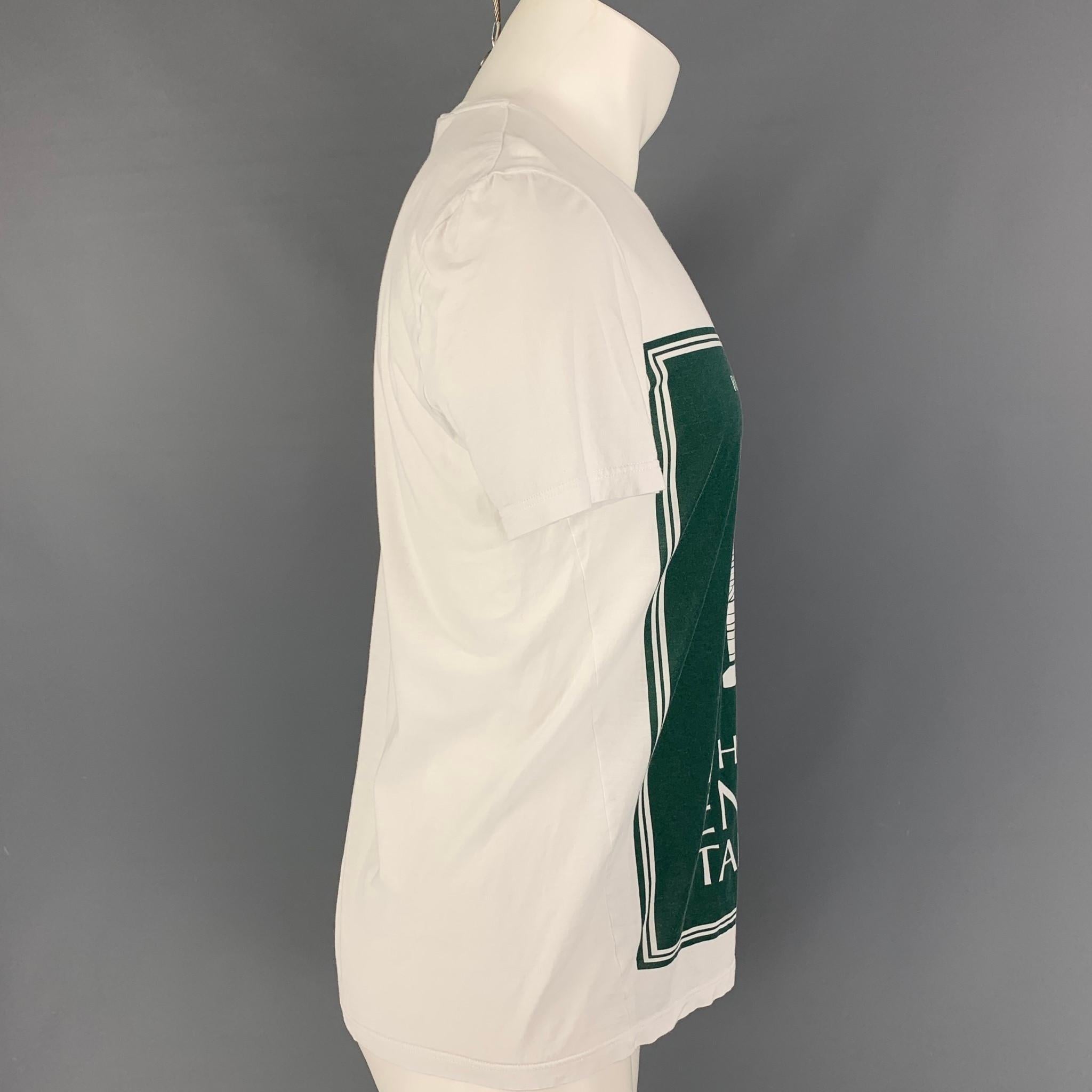 BURBERRY PRORSUM Spring 2015 t-shirt comes in green& white cotton featuring 'A History Of English Tailoring' graphic and a crew-neck. 

Very Good Pre-Owned Condition.
Marked: S

Measurements:

Shoulder: 18.5 in.
Chest: 38 in.
Sleeve: 9 in.
Length:
