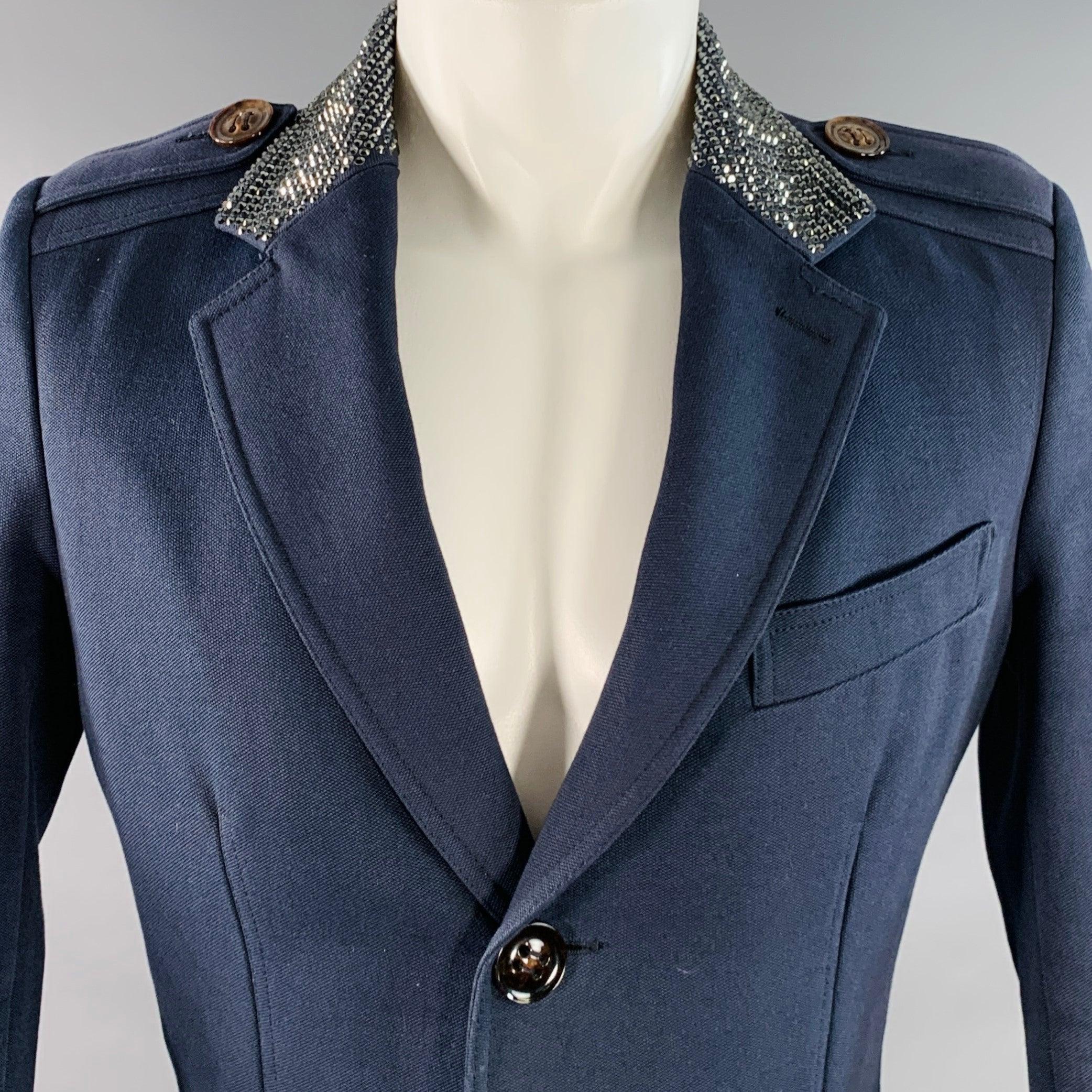 Vintage BURBERRY PRORSUM SS07 coat by CHRISTOPHER BAILEY in a navy cotton wool woven blend featuring a notch lapel with crystal embellished collar, three pockets (one slip, two buttoned with flaps), and button closure. Made in Italy.Very Good