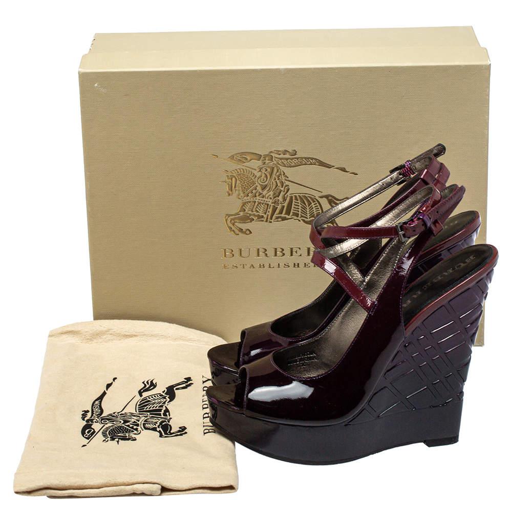 This beautiful pair of patent leather sandals will bring you a confident, comfortable walk. Set on check wedges and a leather base, these uber-stylish sandals are perfect for any season. The Burberry pair in burgundy will be a prized buy.

Includes: