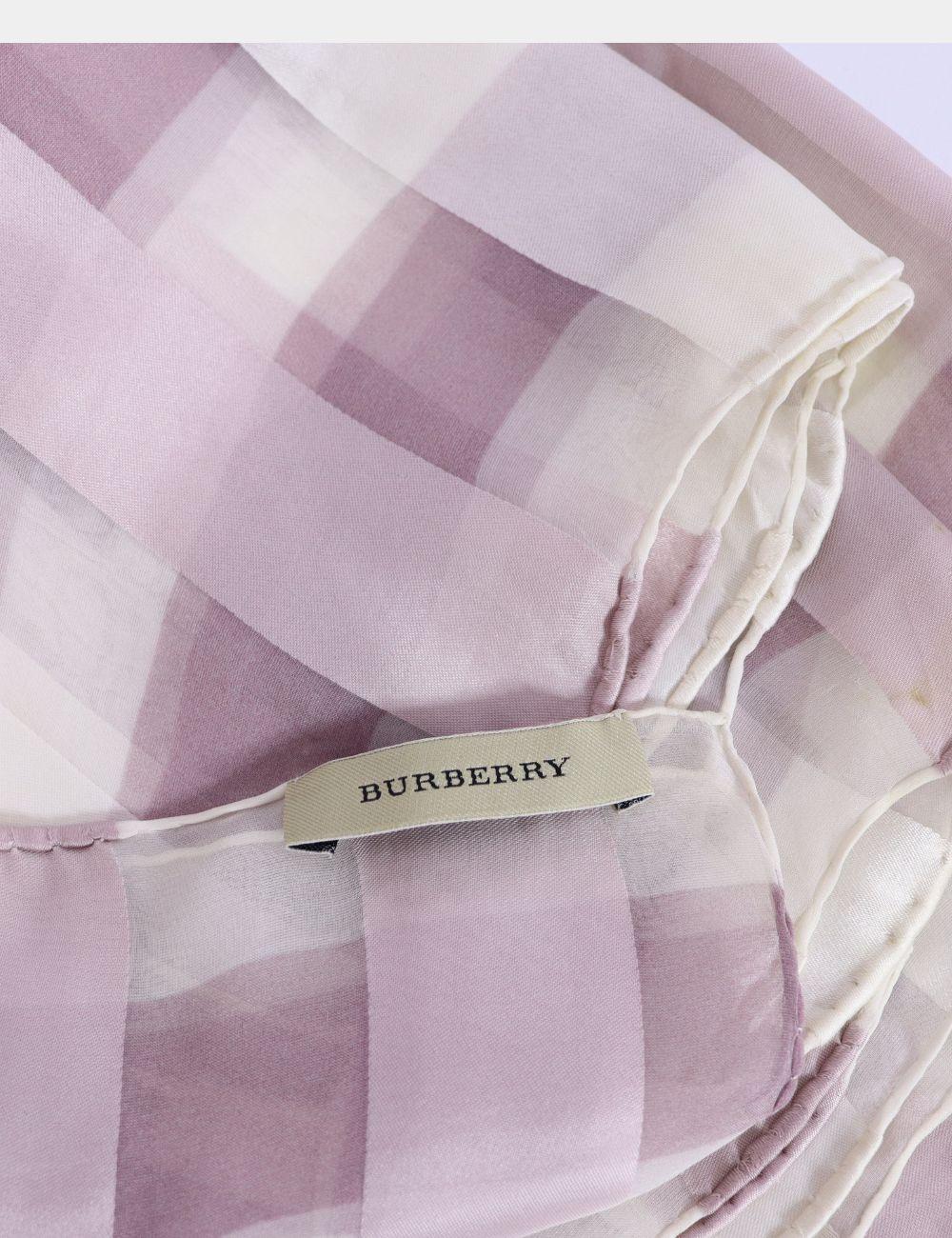 Timeless and elegant, this Burberry Pink Check Silk Scarf offers a fresh, feminine twist on the brand’s iconic check pattern. Crafted from lightweight, luxurious silk, this versatile piece drapes beautifully and adds a soft, polished touch to any