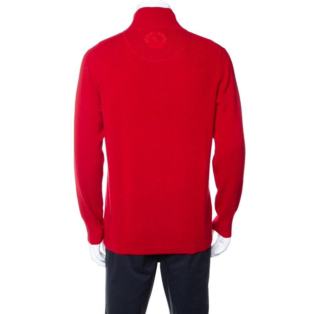 Up your style quotient with this simple yet impactful sweater from Burberry. Crafted from cashmere, this stylish creation comes in a red hue. It is styled with a standing collar, zipper placket, long sleeves, and logo detailing at the back. It is