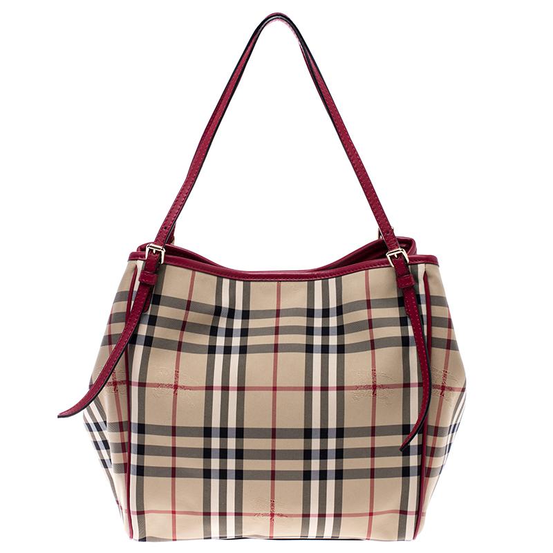 This Canterbury tote from Burberry is crafted from PVC in their signature Haymarket check. It comes with dual flat handles, protective metal feet and a canvas-lined interior that can hold all your daily necessities. Simple in design, the bag is