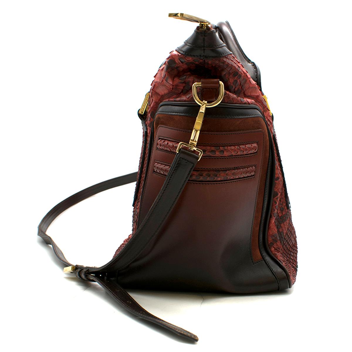 Burberry Red Large Python Travel Bag

-Red Python and leather exterior 
-Gold hardware
-Brown leather handles
-Removable and adjustable shoulder trap 
-Suede lining
-Two functional open pockets inside 
-One zip pocket inside 
-Gold zip closure