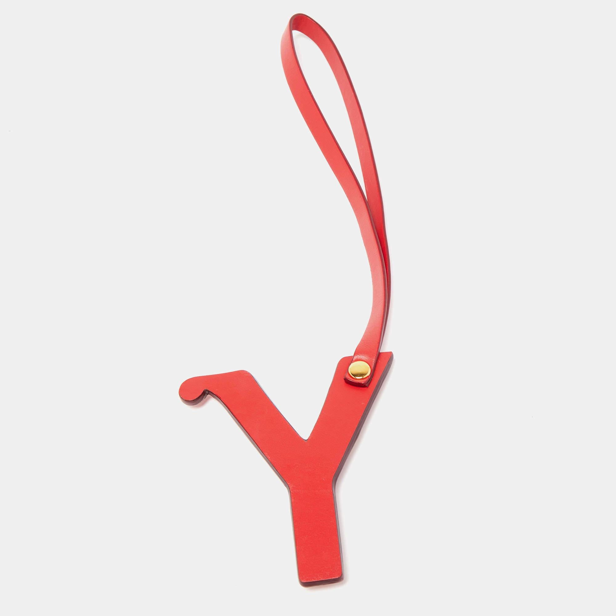 This stylish Hermes bag charm is made of leather as the letter 'Y'. It has gold-tone metal details on it and is accompanied by a matching strap.

Includes: Original Box

