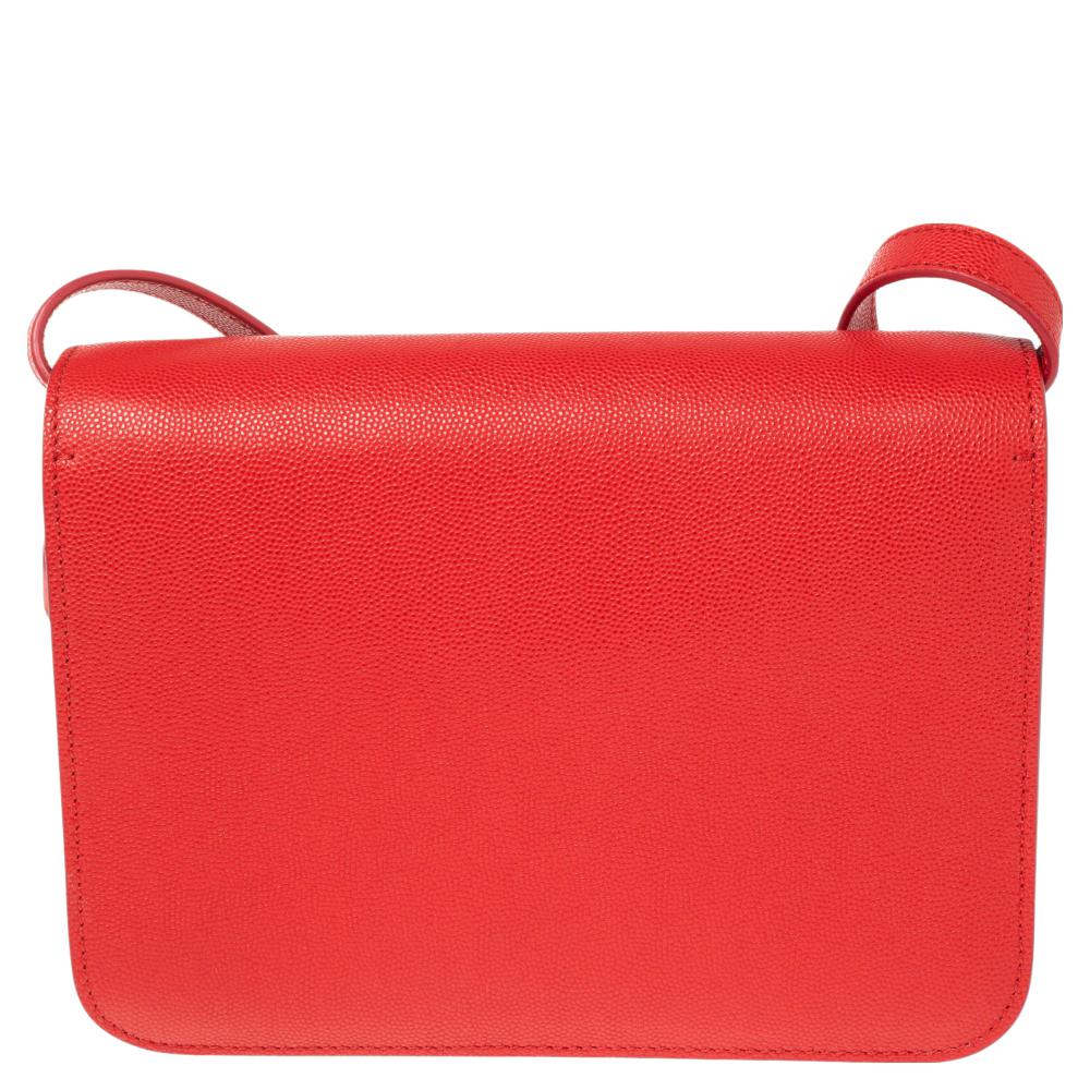 Burberry's red leather shoulder bag is a knowing investment piece that's on-trend now, too. It's finished with an elegant gold-tone metal TB clasp as well as an adjustable shoulder strap so it can be worn in a number of different ways. With more