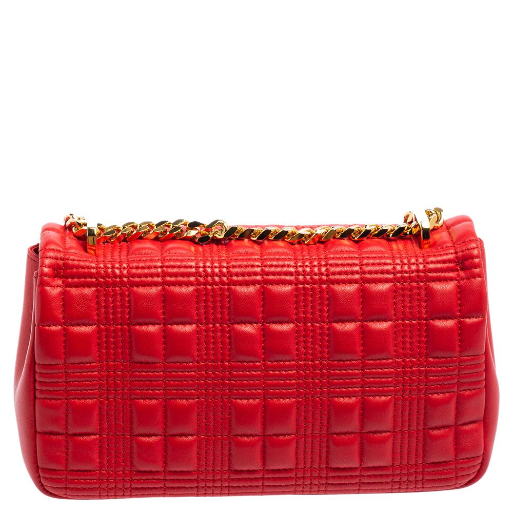 Recognized to add elements of elegance and high-end fashion into its pieces, this Lola shoulder bag from Burberry does complete justice to the brand's heritage and aesthetic. Externally, it is made using red quilted leather with a gold-toned accent