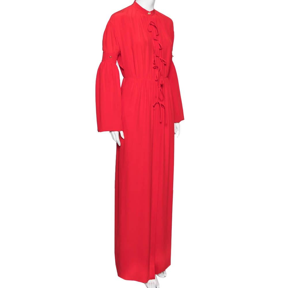 With its eye-catchy hue and chic design, this dress from the House of Burberry will surely make you the star of any event. It is tailored using red silk fabric into a flowy maxi-length silhouette. It has a button-down feature, multiple tie details
