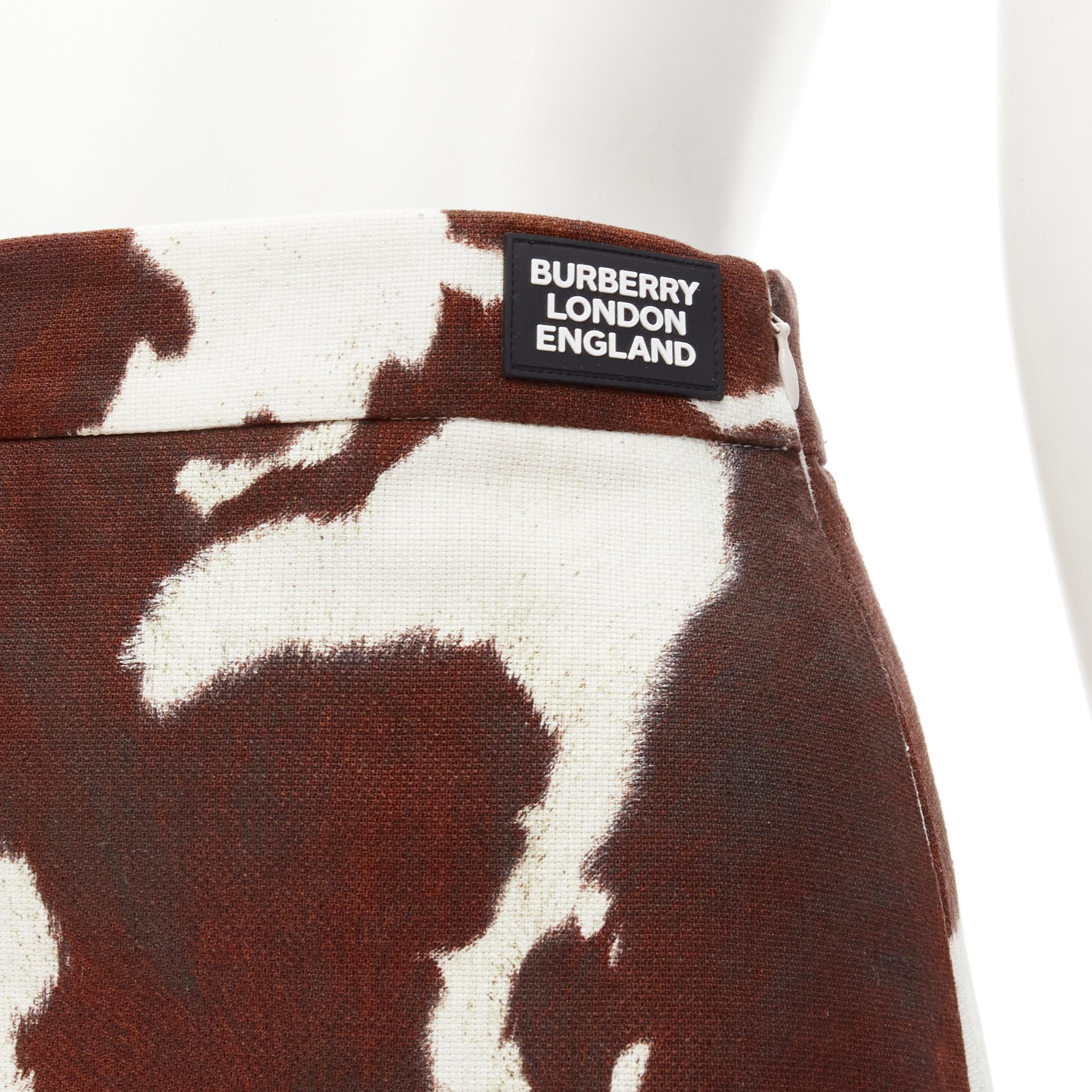 BURBERRY Riccardo Tisci brown cow print leg garter mini skirt S
Brand: Burberry
Extra Detail: Attached leg garter strap. Burberry London England rubber logo patch at front waist. Side zip closure.

CONDITION:
Condition: Excellent, this item was