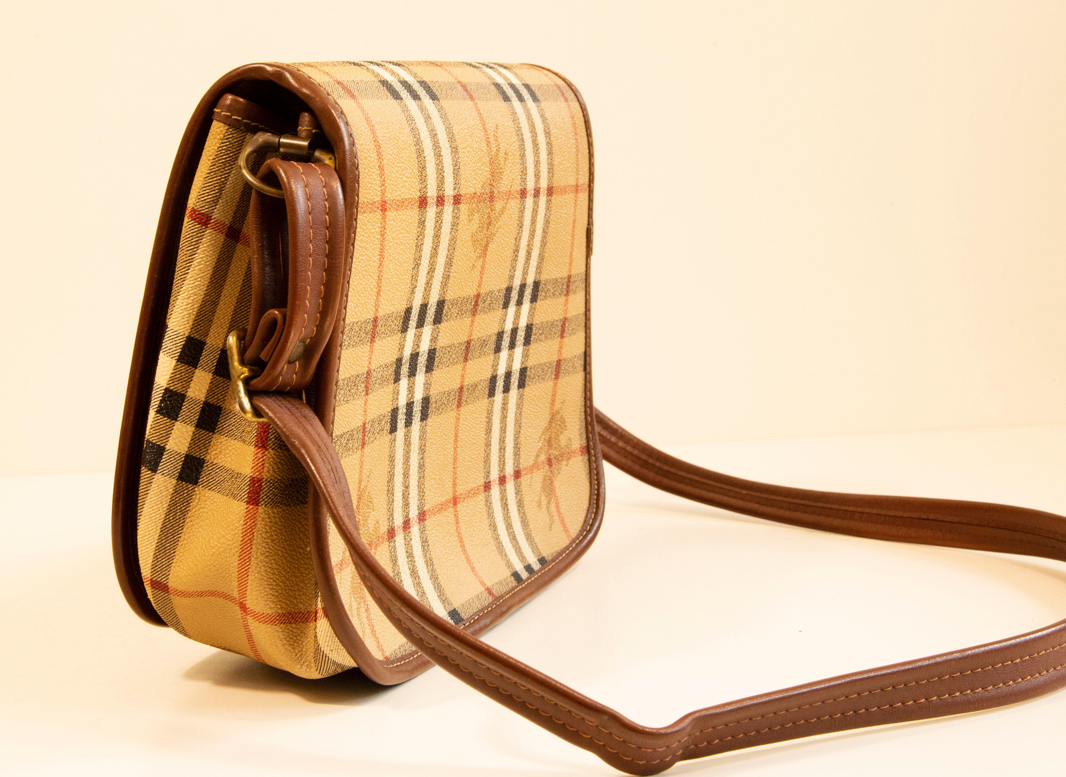 Burberry Saddle Bag in Coated Canvas with the Burberry Classic Check Print In Good Condition For Sale In Arnhem, NL