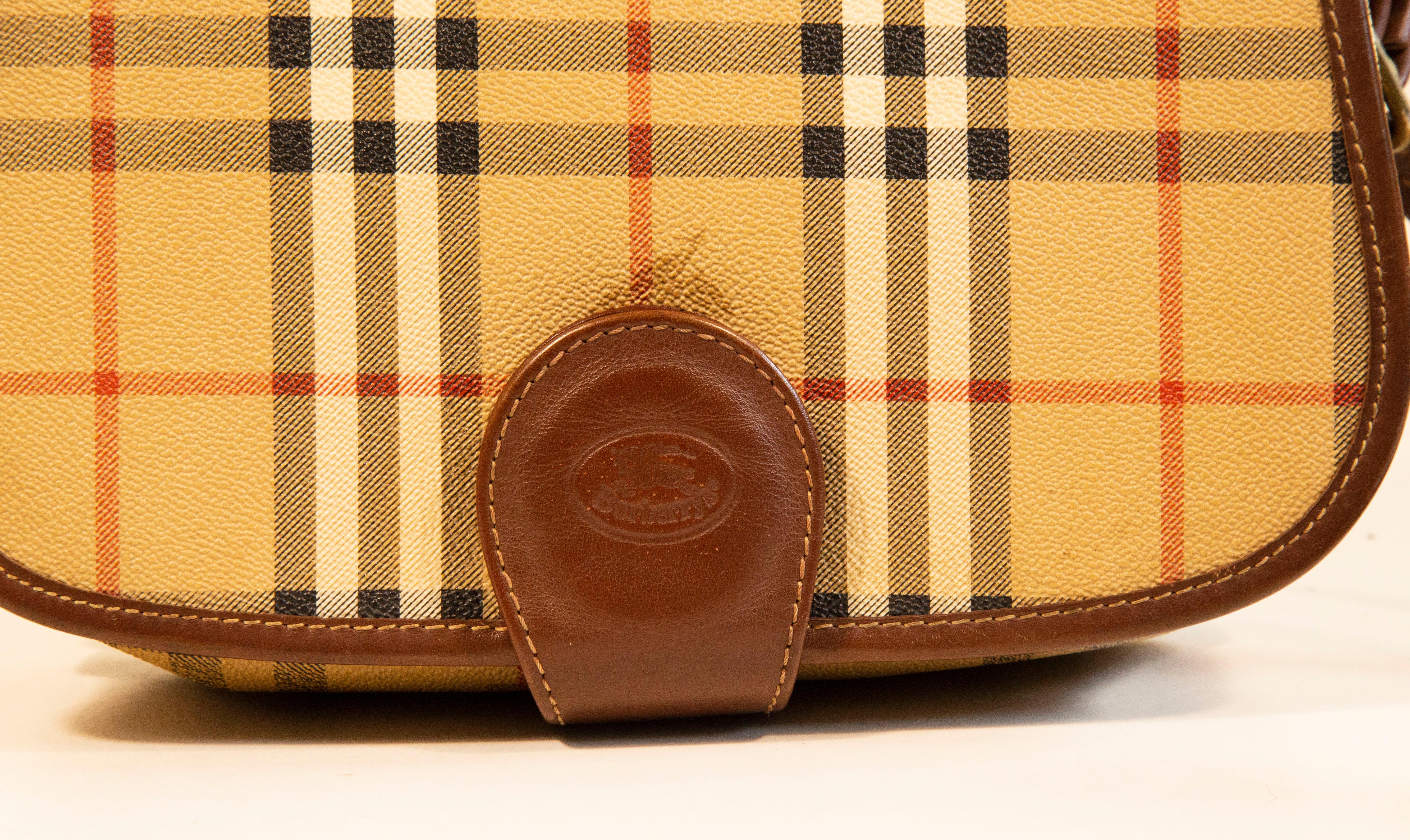 Burberry Saddle Bag in Coated Canvas with the Burberry Classic Check Print For Sale 1