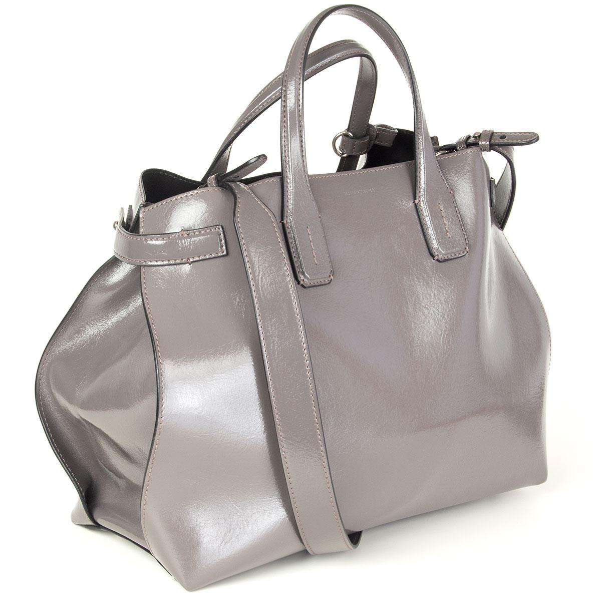 Burberry 'Banner Soft Medium' tote in Sepia (pewter grey) wrinkly high-shine leather. Lined in black leather with one zipper pocket and two open pockets against the back and two open pockets against the front. Has been carried and is in excellent