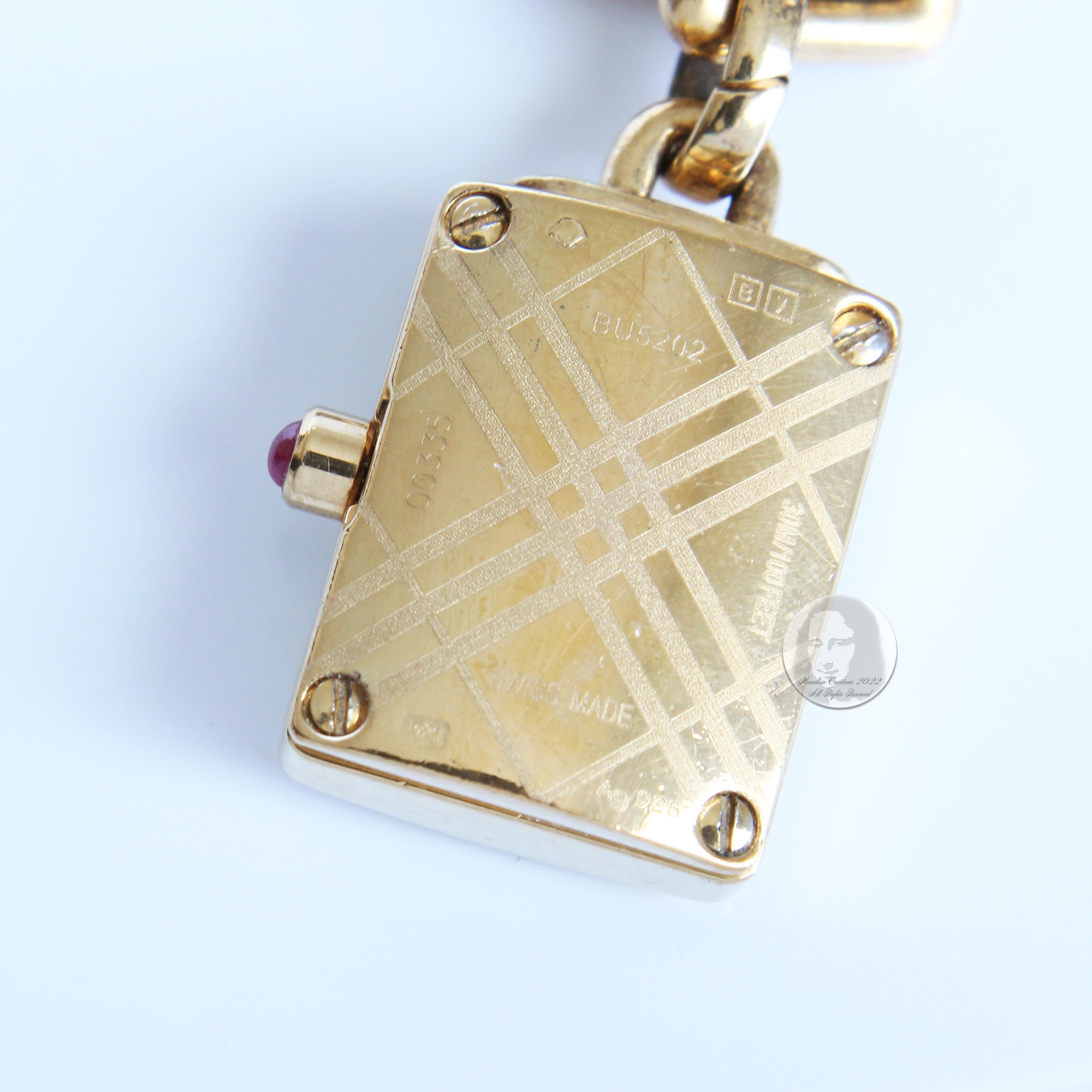 Burberry Signature Charm Bracelet Watch Gold Plated Sterling Silver Style BU5202 In Good Condition In Port Saint Lucie, FL