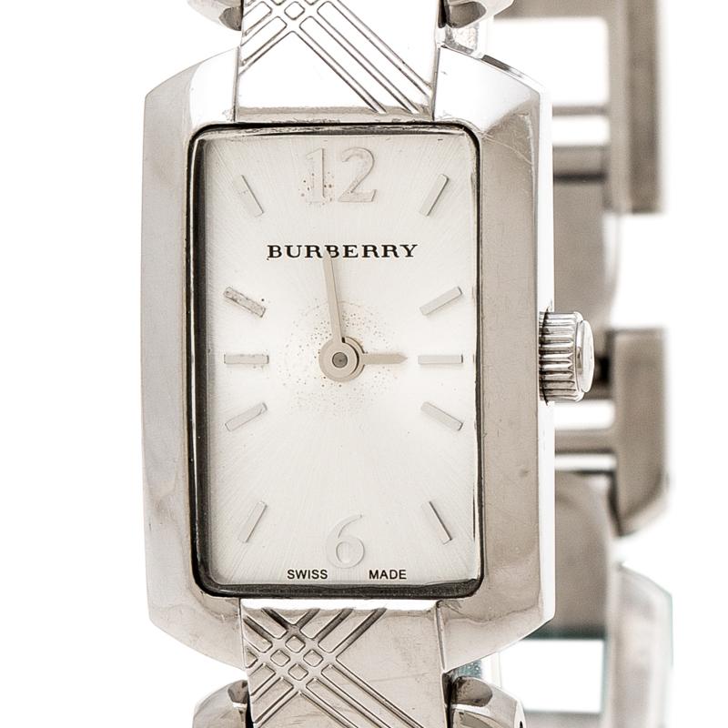 Awaiting to be yours is this stunner of a watch from Burberry! Crafted with beauty using stainless steel, the Quartz watch has a bracelet detailed in their signature check. It brings a silver dial that has index hour markers and two Arabic numerals