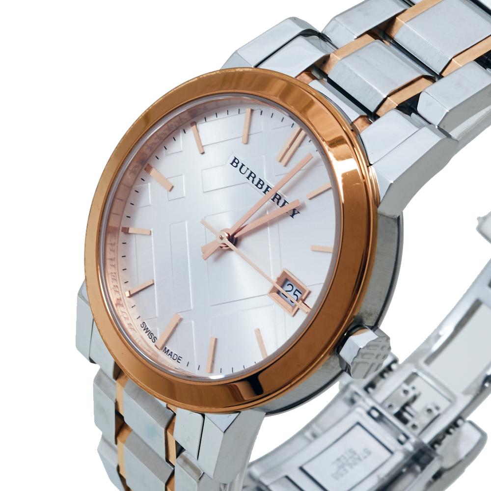Your everyday style deserves a luxurious touch like this wristwatch from Burberry. It is made from two-toned stainless steel and has a white dial with index hours markers, minute markers around the outer rim, a date window, and three hands. The