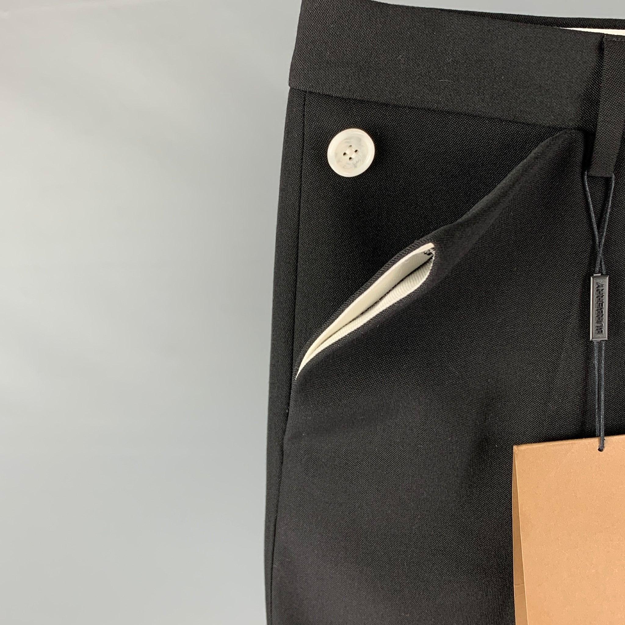 BURBERRY dress pants comes in a black wool featuring a flat front, button pocket details, front tab, and a zip fly closure. Made in Italy.
New With Tags.
 

Marked:   46 

Measurements: 
  Waist: 32 inches  Rise: 10.5 inches  Inseam:
33 inches 
  
 