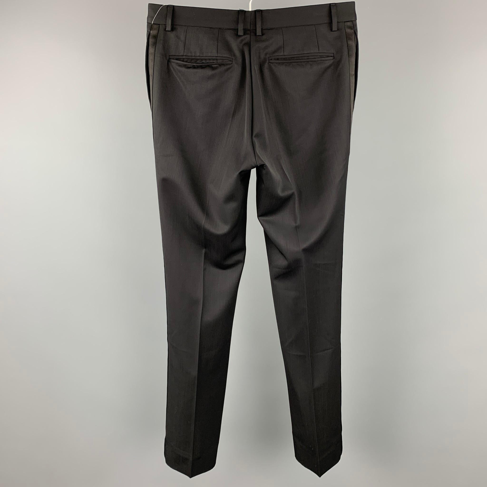 BURBERRY tuxedo dress pants comes in a black wool featuring a slim fit, front tab, and a zip fly closure. 

Very Good Pre-Owned Condition.
Marked: Custom

Measurements:

Waist: 31 in.
Rise: 8.5 in.
Inseam: 32 in. 