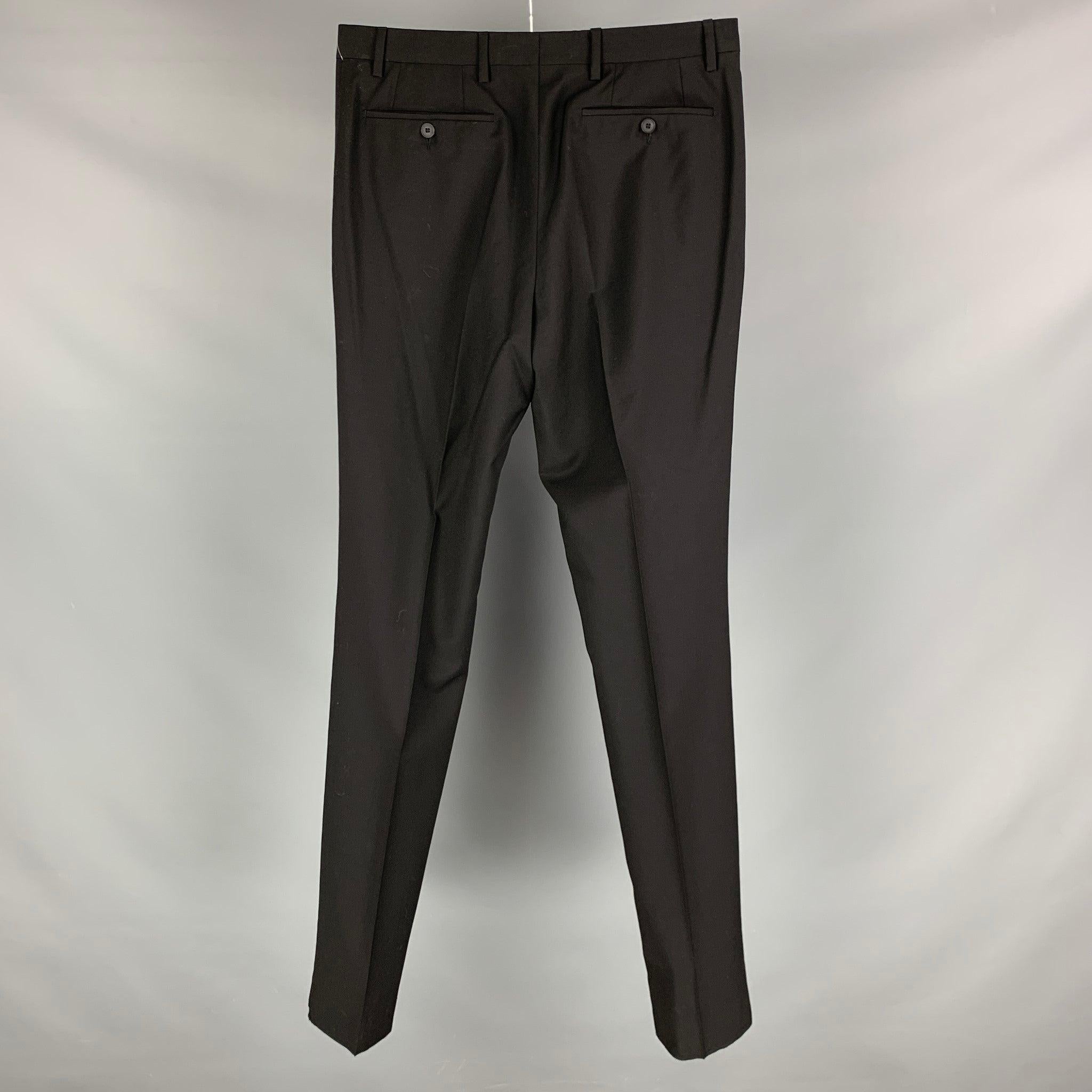 BURBERRY dress pants comes in a black virgin wool featuring a flat front, front tab, and a hook and eye closure. Made in Italy. New With Tags. Minor Mark at Front. 

Marked:  48 

Measurements: 
 Waist: 25 inches Rise: 11.5 inches Inseam: 37.5