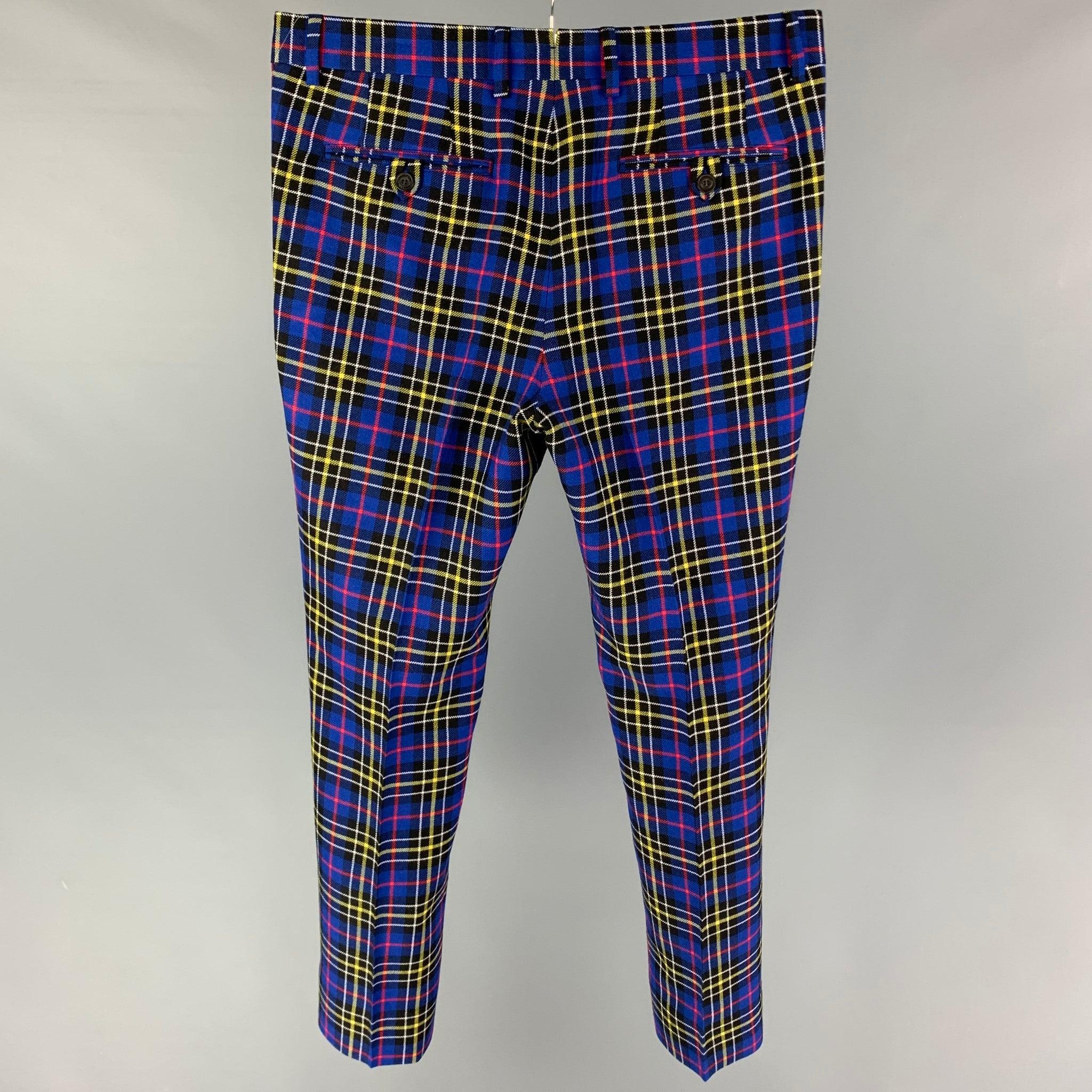 BURBERRY dress pants comes in a blue multi-color plaid wool featuring a flat front, front tab, and a zip fly closure. Made in Italy.
Very Good Pre-Owned Condition. 

Marked:   50 

Measurements: 
  Waist: 34 inches  Rise: 10 inches  Inseam: 30