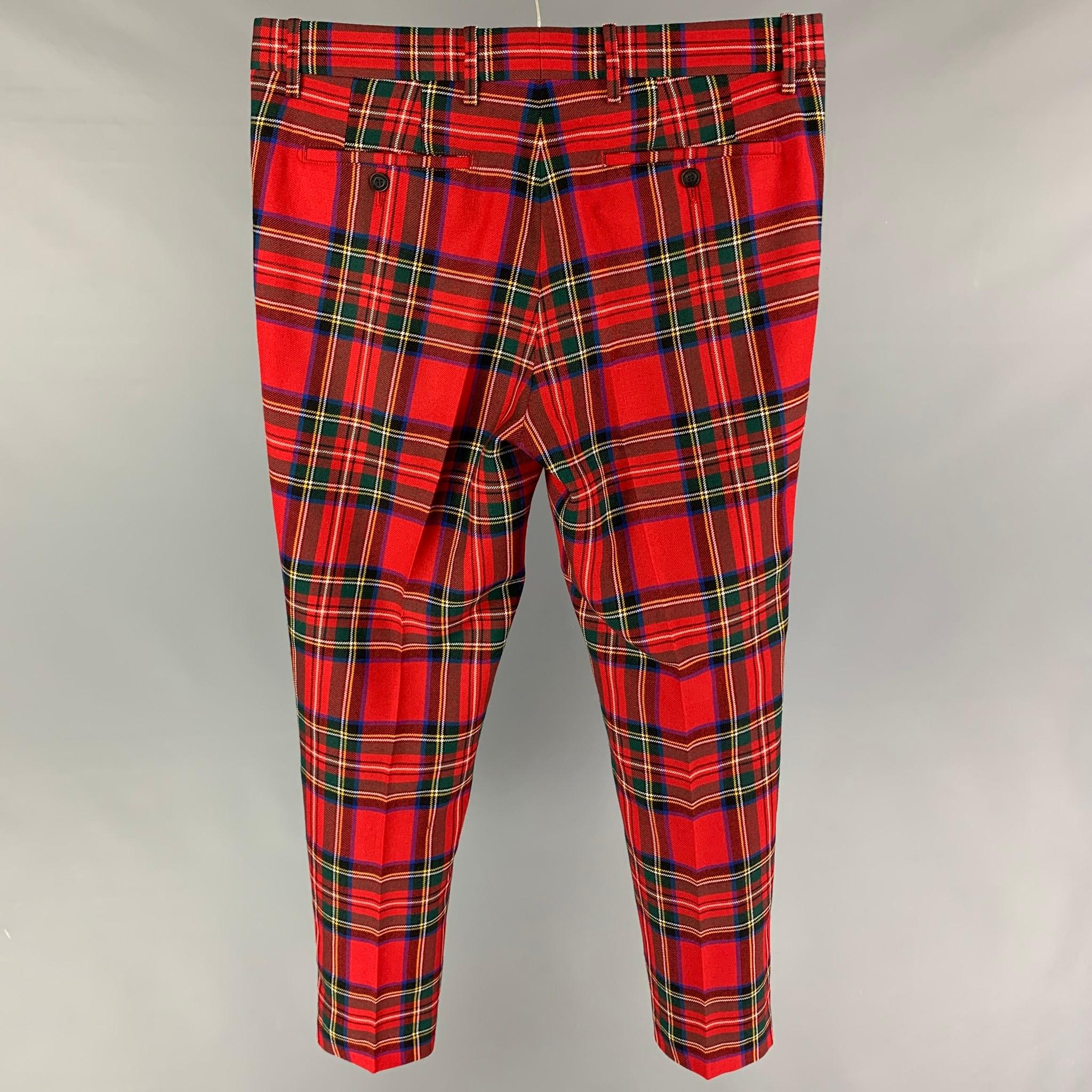 BURBERRY dress pants comes in a red multi-color plaid wool featuring a flat front, front tab, and a zip fy closure. Made in Romania. 

Excellent Pre-Owned Condition.
Marked: 52

Measurements:

Waist: 36 in.
Rise: 10.5 in.
Inseam: 29 in. 