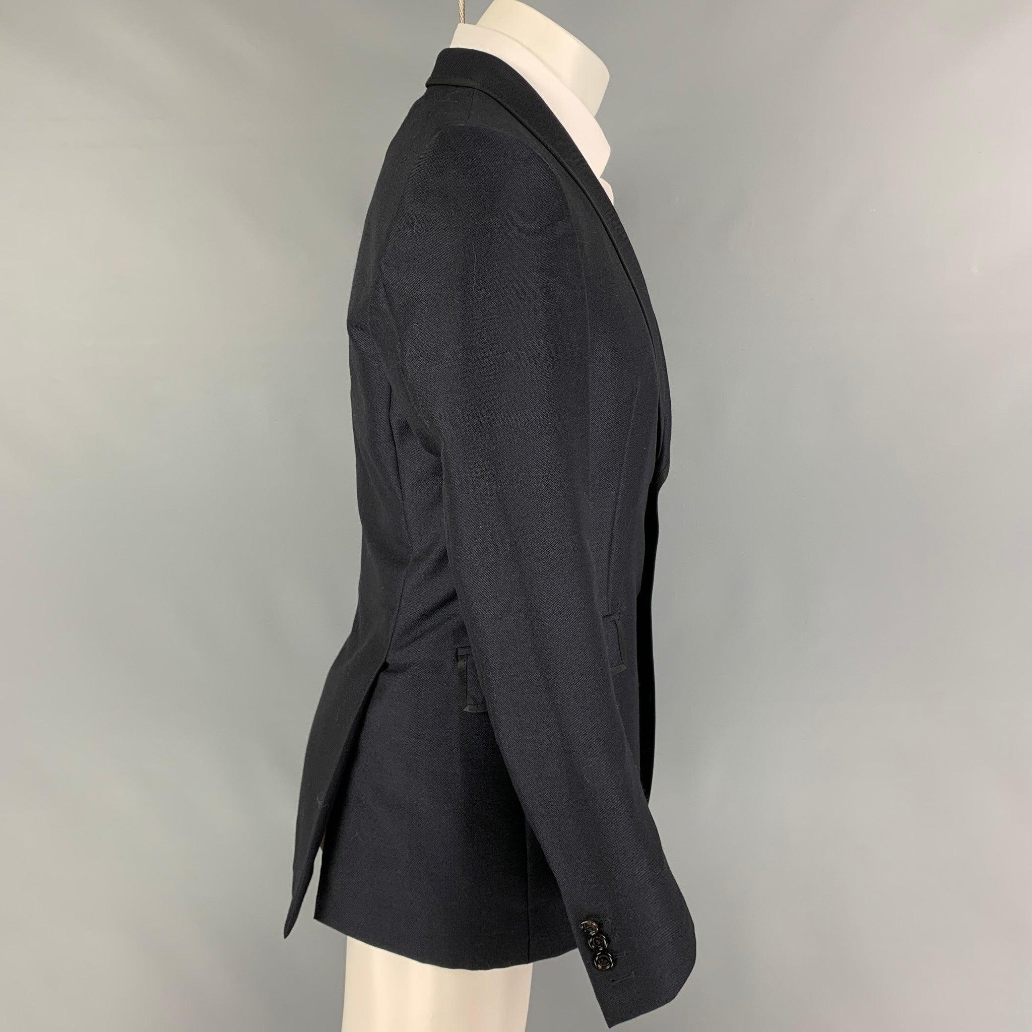 BURBERRY sport coat comes in a navy mohair / wool with a full liner featuring a shawl collar, flap pockets, double back vent, and a double button closure. Made in Italy.
Excellent
Pre-Owned Condition. 

Marked:   48 

Measurements: 
 
Shoulder:
17