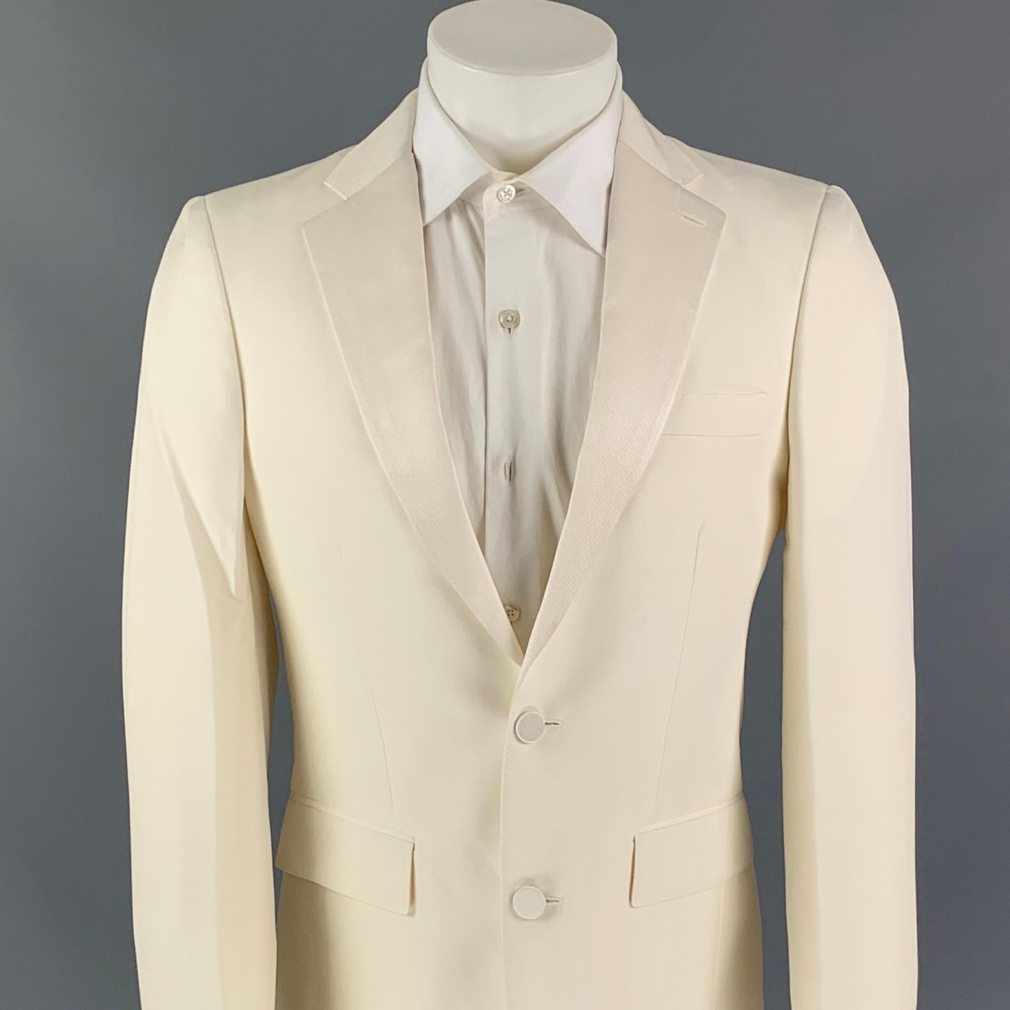BURBERRY sport coat comes in a cream silk with a full liner featuring a notch lapel, flap pockets, double back vent, and a two button closure. Made in Italy. 

Very Good Pre-Owned Condition.
Marked: 48R

Measurements:

Shoulder: 17 in.
Chest: 38