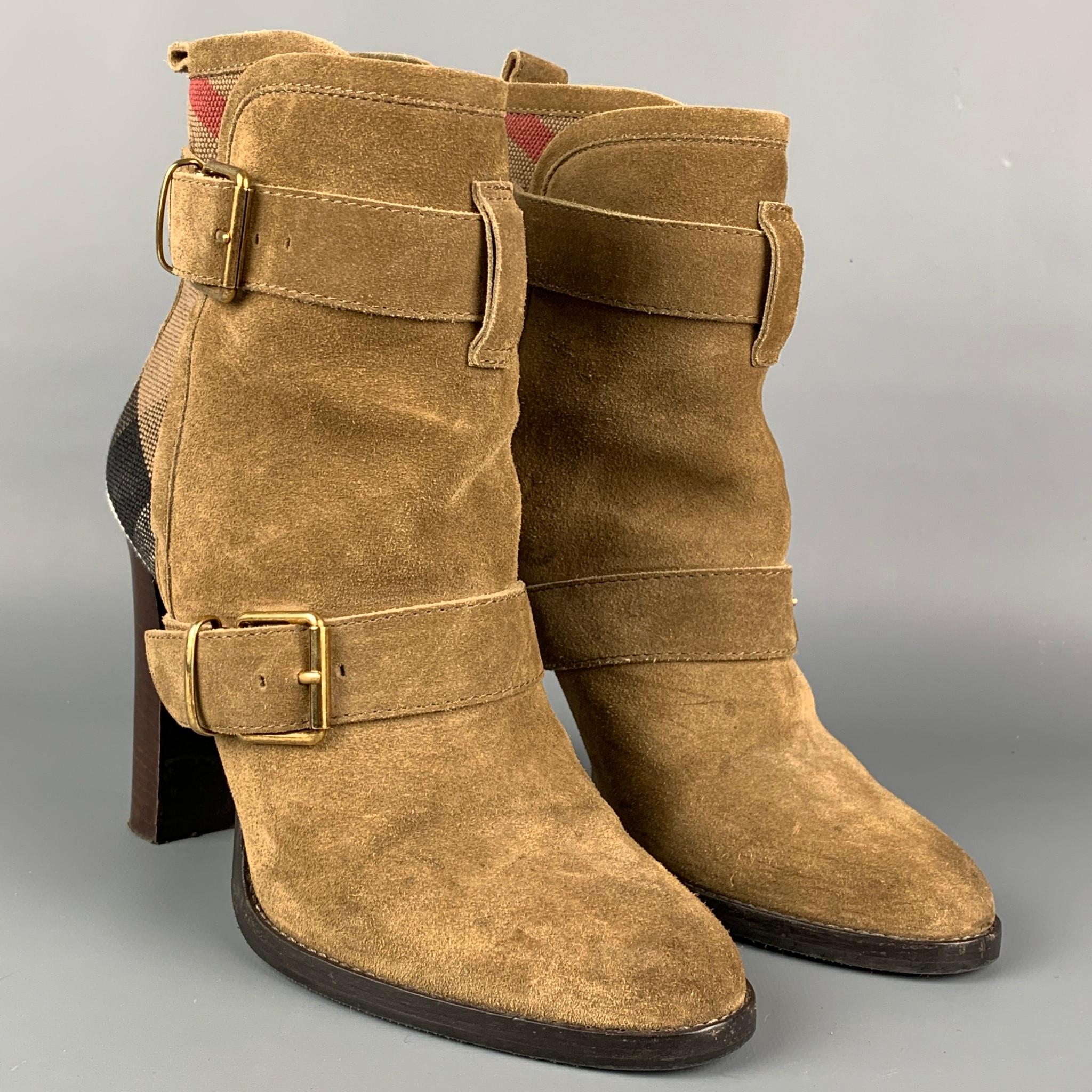 BURBERRY boots comes in a khaki suede with a plaid trim featuring a double strap buckle closure and a chunky heel. 

Good Pre-Owned Condition.
Marked: 38

Measurements:

Length: 8.5 in.
Width: 3.5 in.
Height: 5 in.
Heel: 4 in. 