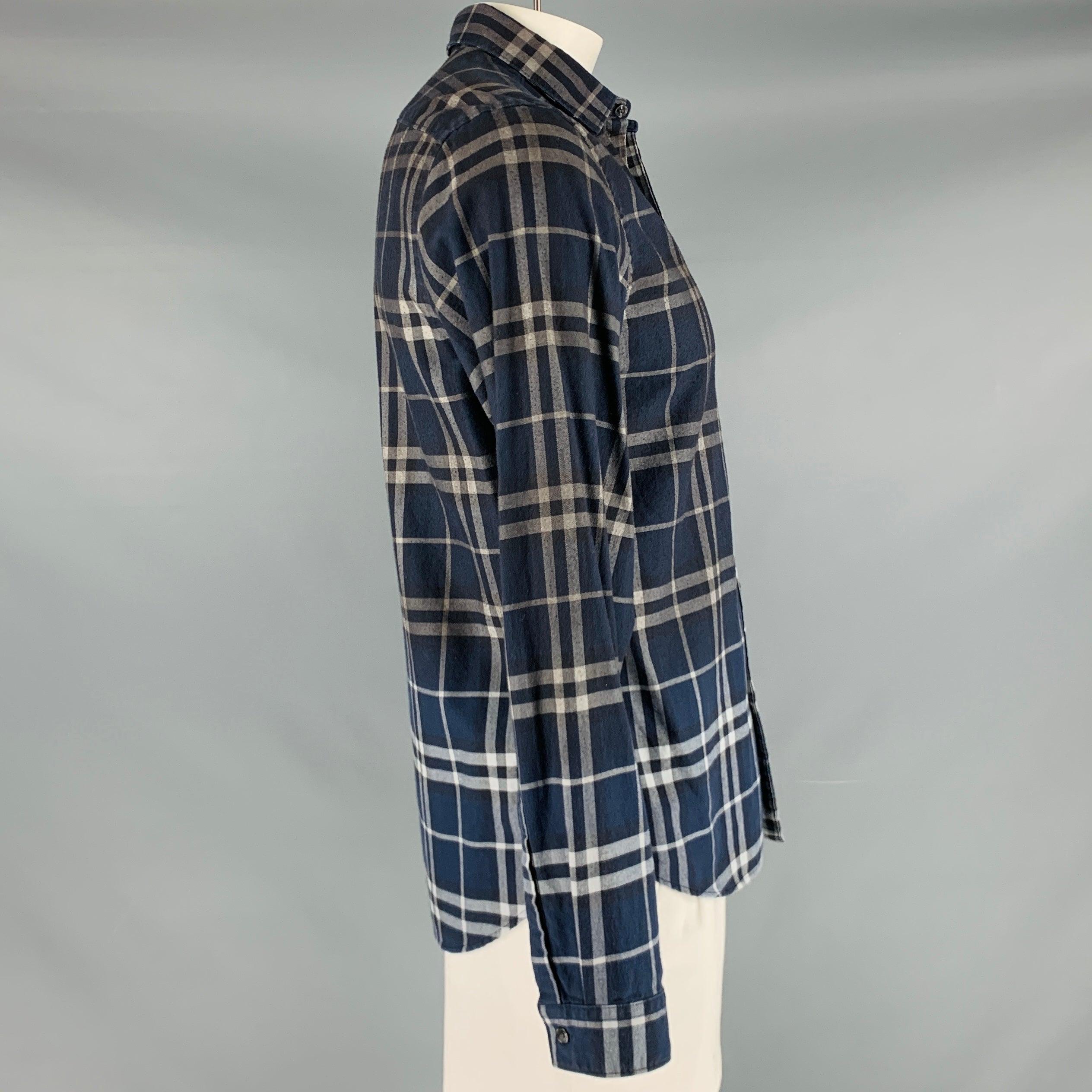 BURBERRY BRIT long sleeve shirt
in a navy and grey cotton woven fabric featuring a plaid pattern, spread collar, and button closureGood Pre-Owned Condition. Moderate pilling. 

Marked:   L 

Measurements: 
 
Shoulder: 17 inches Chest: 41 inches