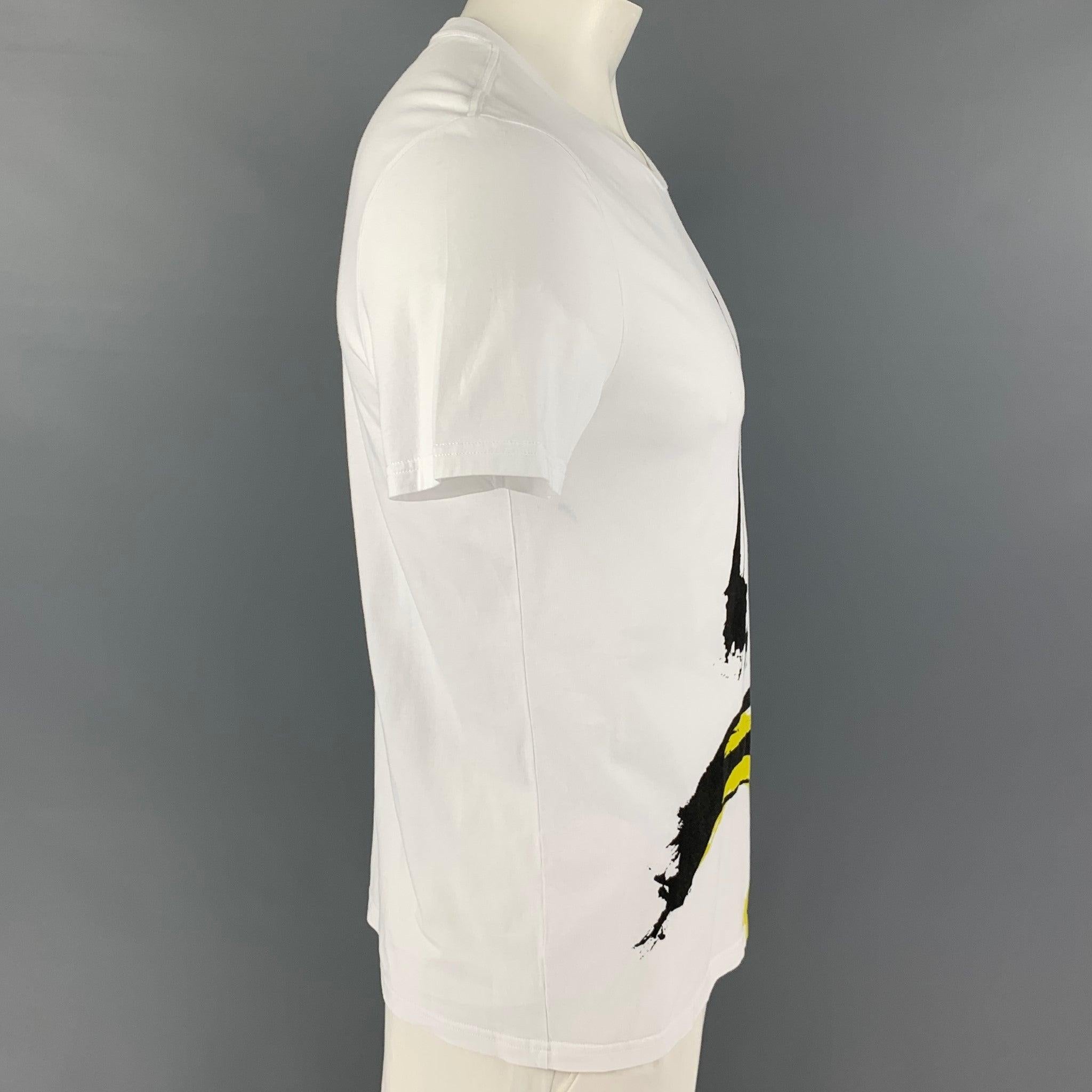 BURBERRY BRIT t-shirt comes in a white & black cotton featuring a graphic and a crew-neck.
Excellent
Pre-Owned Condition. 

Marked:   L  

Measurements: 
 
Shoulder:
18.5 inches Chest: 40 inches Sleeve: 8 inches Length: 27 inches 
  
  
 
Reference: