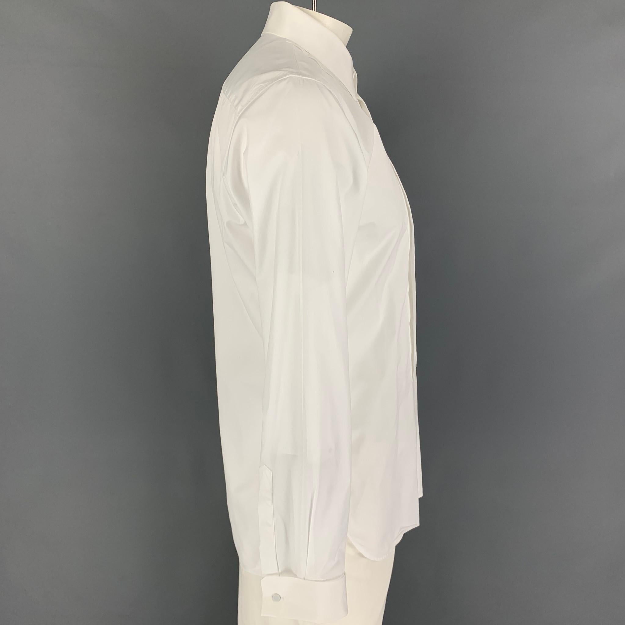BURBERRY long sleeve shirt comes in a white cotton featuring a slim fit, pleated panel, french cuffs, spread collar, and a hidden placket closure. Made in Italy.

Excellent Pre-Owned Condition.
Marked: 17-43
Original Retail Price: