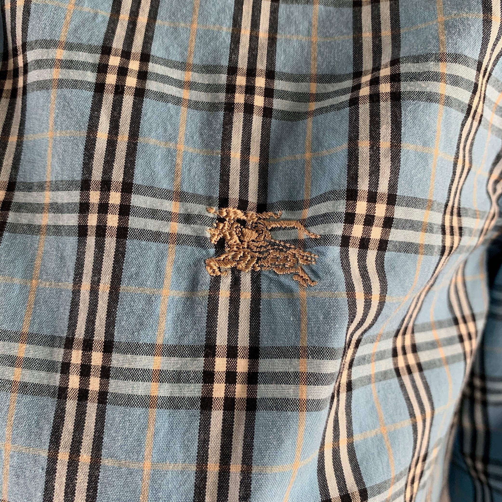BURBERRY Blue label Japan Exclusive 3/4 sleeve shirt in a black, blue and white cotton woven fabric featuring a plaid pattern, spread collar, and button closureGood Pre-Owned Conditio 

Marked:   38 

Measurements: 
 
Shoulder: 15 inches Chest: 35