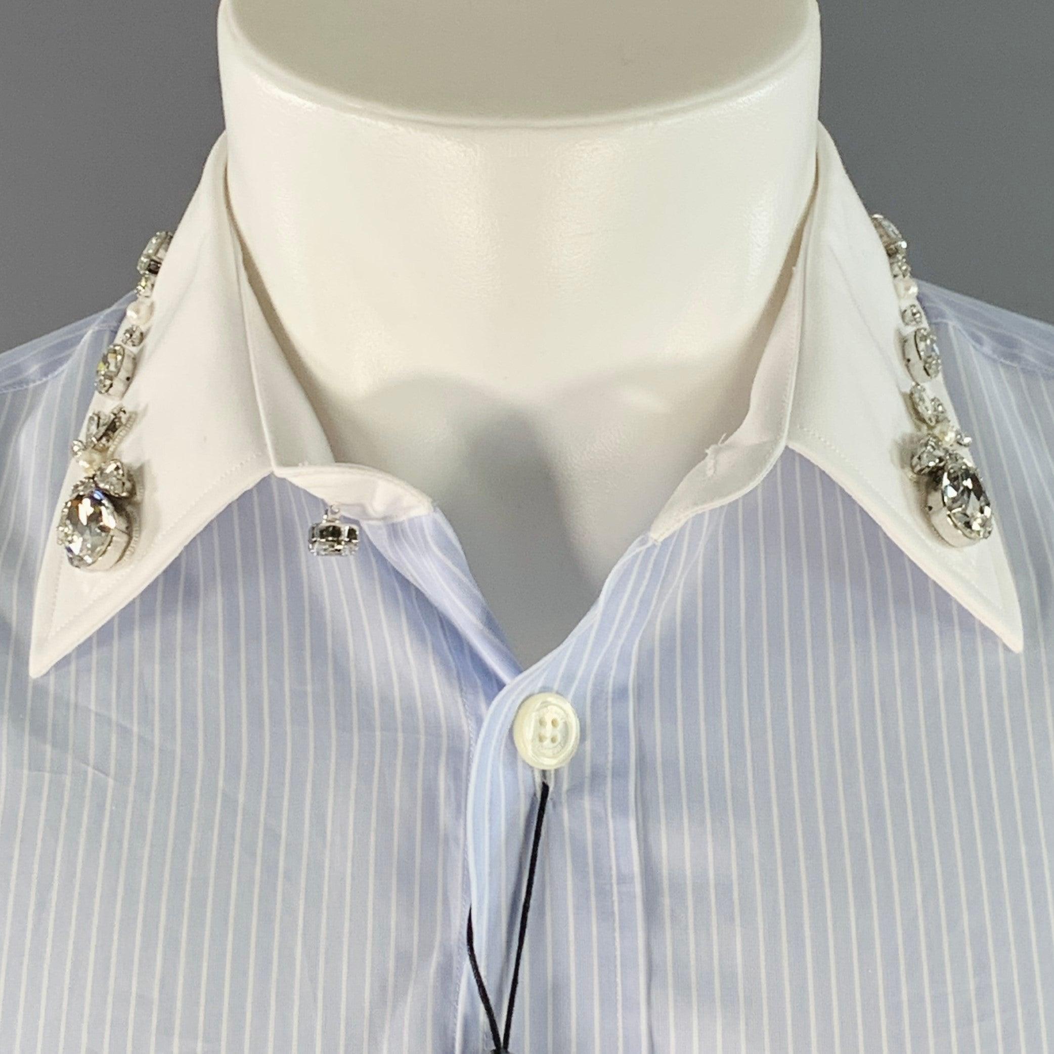 BURBERRY long sleeve shirt
in a blue and white cotton woven fabric featuring a stripe pattern, contrasting white trim with silver tone crystal embellishments on collar and cuffs, one pocket, and button closure. Made in Italy.New with Tags. 

Marked: