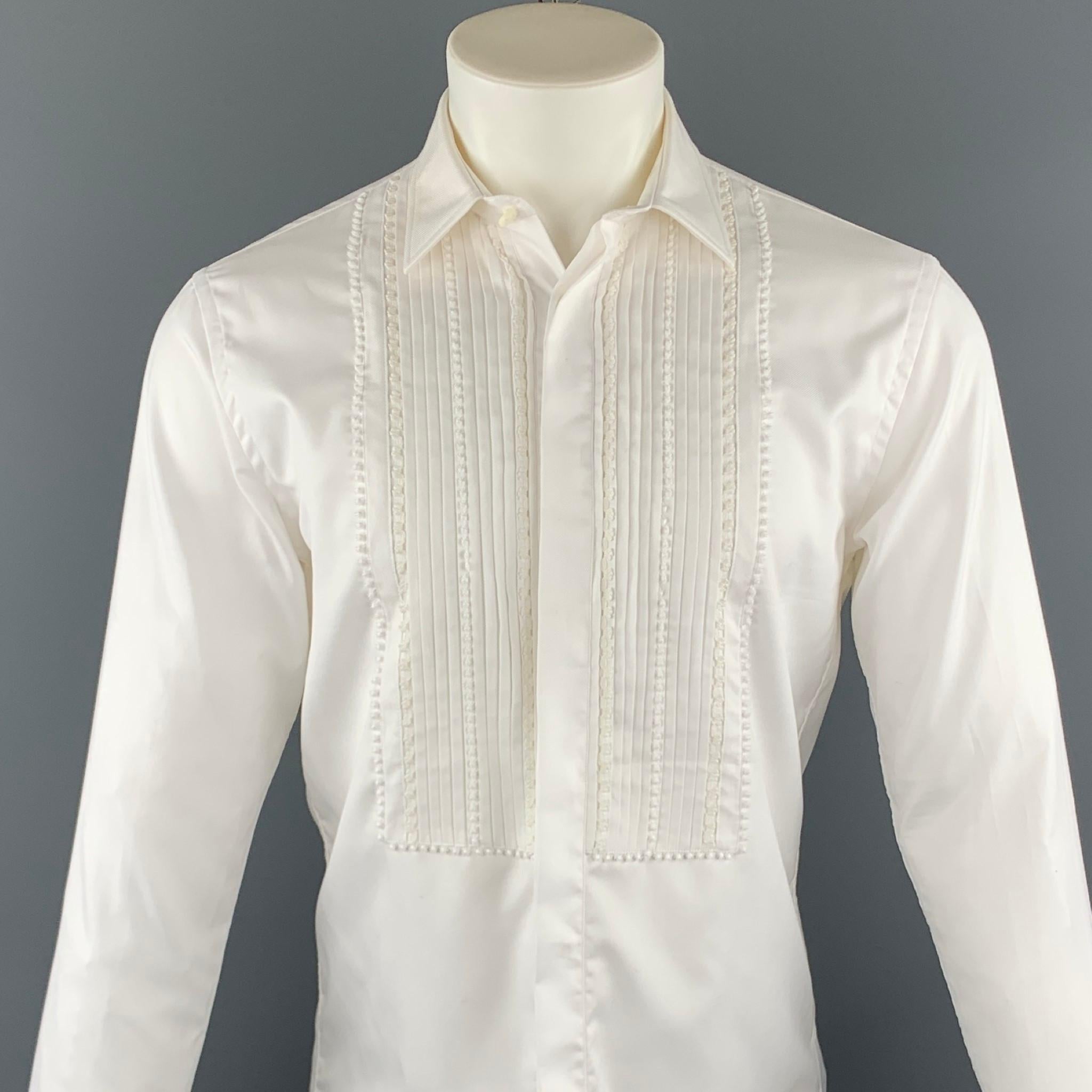 BURBERRY long sleeve shirt comes in a white pleated cotton featuring a tuxedo style, embroidered details, french cuffs, and a hidden button closure. Minor discoloration. As-Is.

Good Pre-Owned Condition.
Marked: 15 / 38

Measurements:
 
Shoulder: